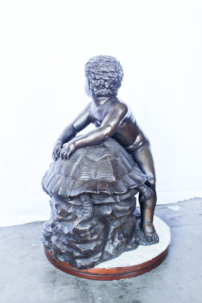 Naked toddler on turtle bronze statue Art Nude -  Size: 23"L x 26"W x 34"H.