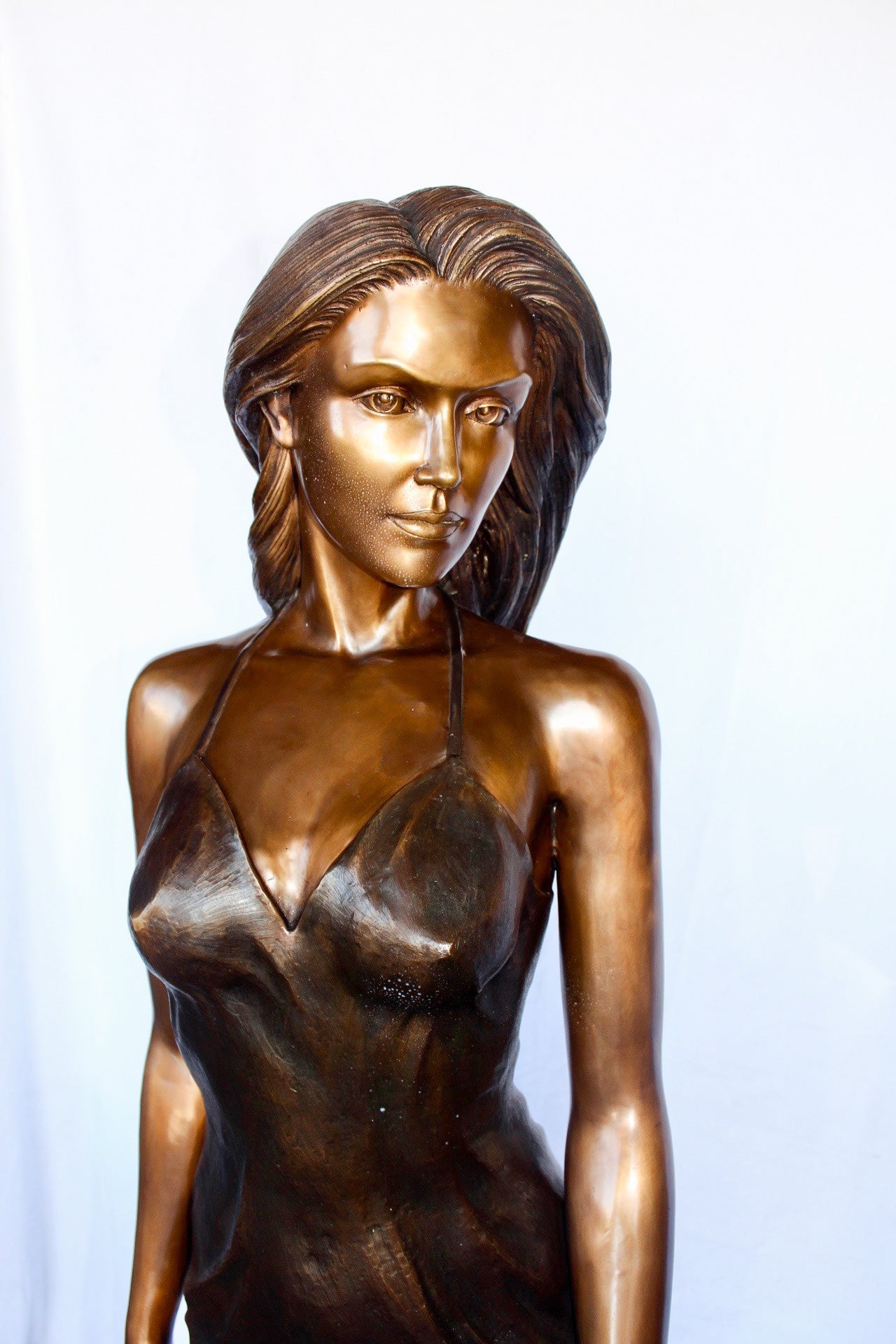 Peaceful woman in dress bronze statue -  Size: 17"L x 25"W x 67"H.