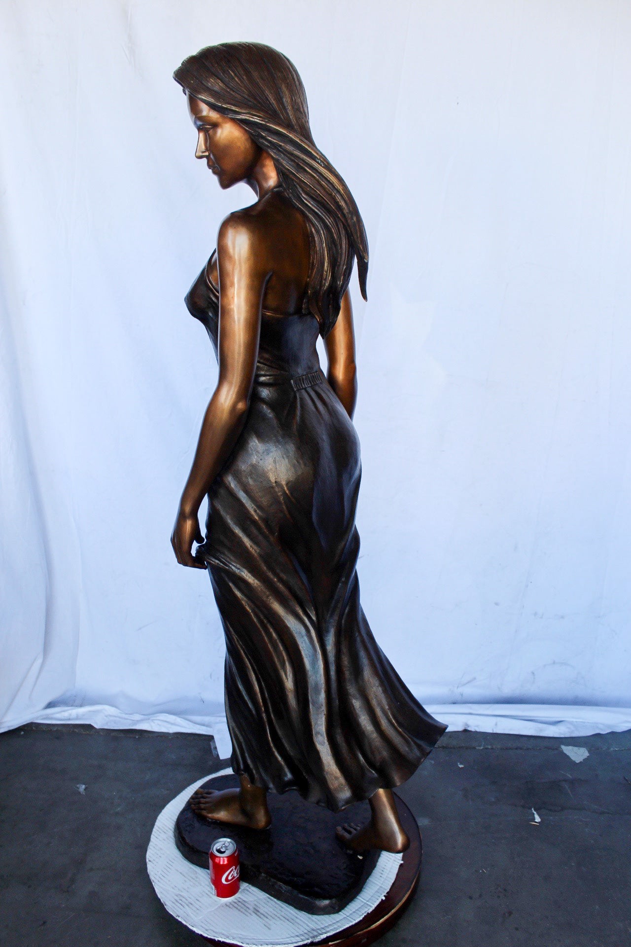 Peaceful woman in dress bronze statue -  Size: 17"L x 25"W x 67"H.