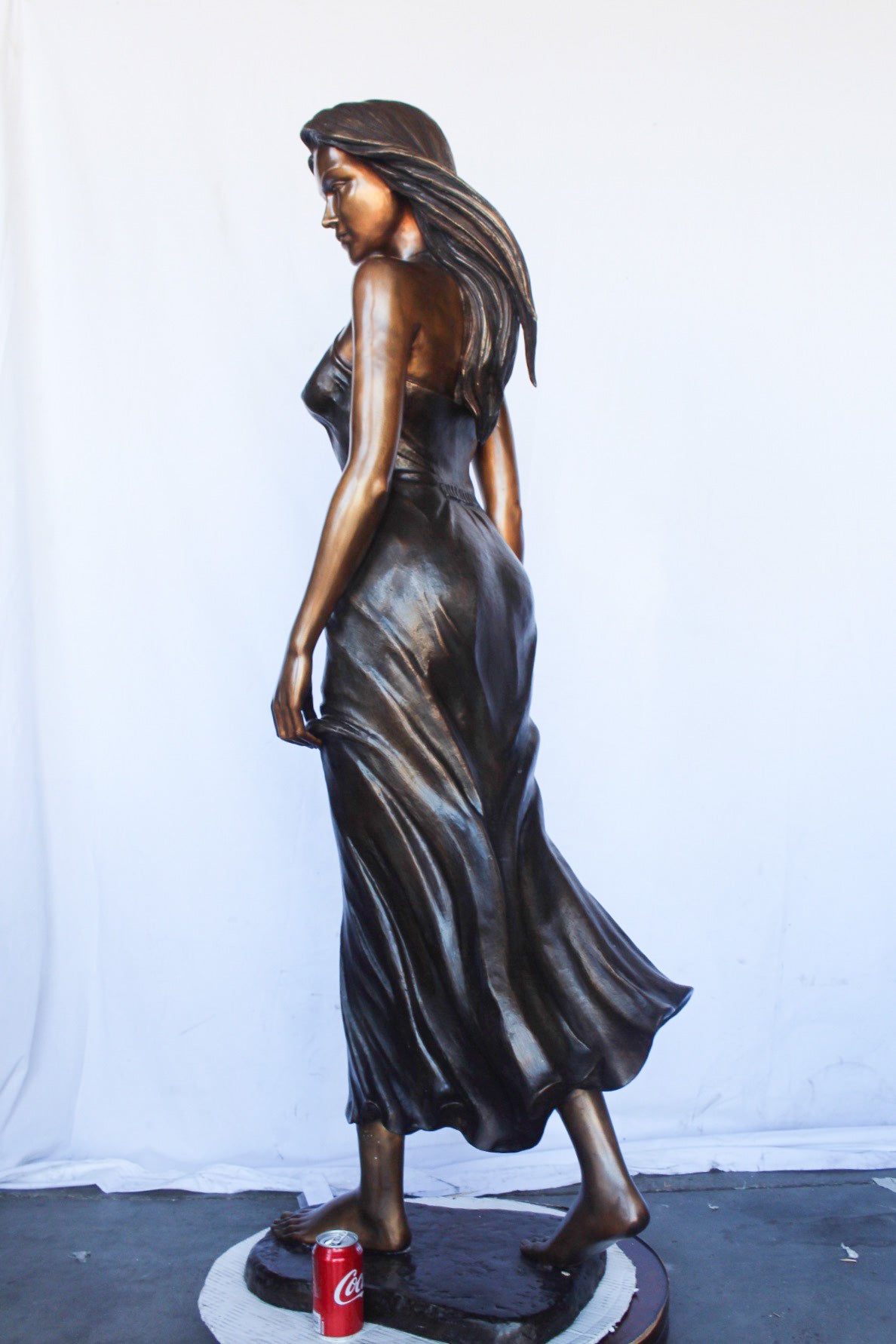 Peaceful woman in dress bronze statue -  Size: 17"L x 25"W x 67"H.