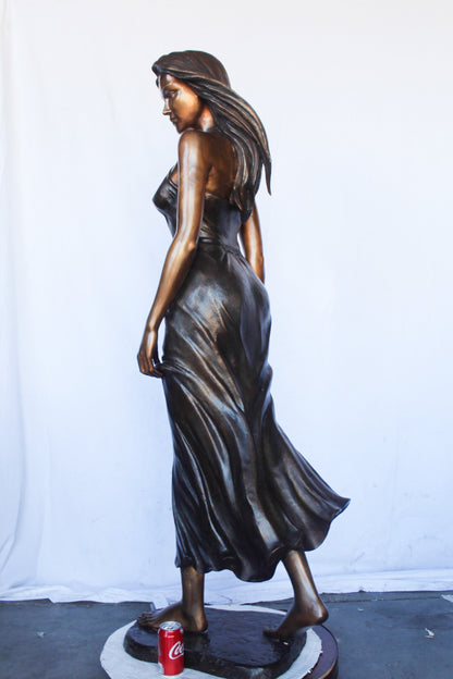 Peaceful woman in dress bronze statue -  Size: 17"L x 25"W x 67"H.