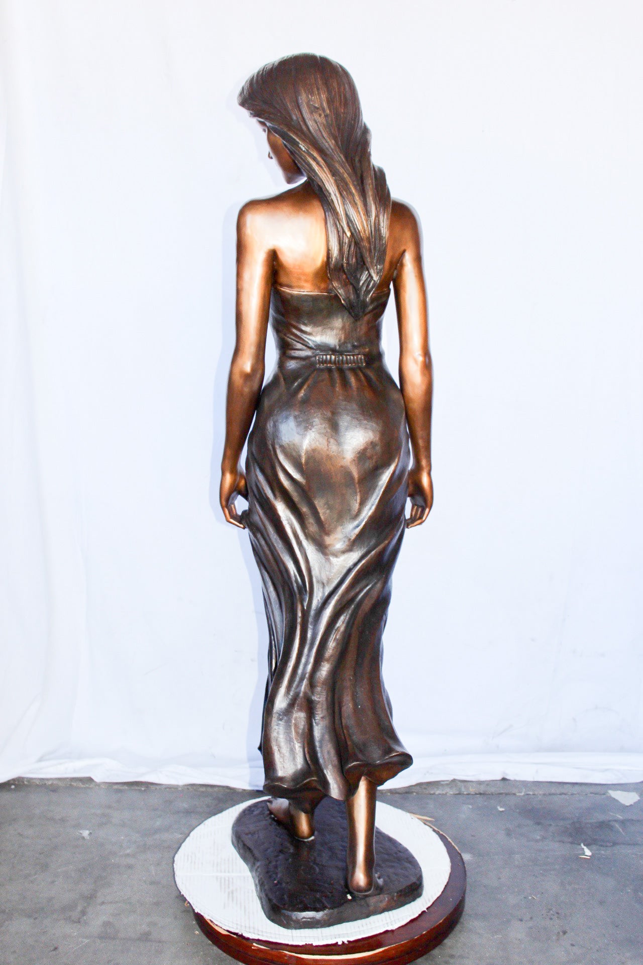 Peaceful woman in dress bronze statue -  Size: 17"L x 25"W x 67"H.