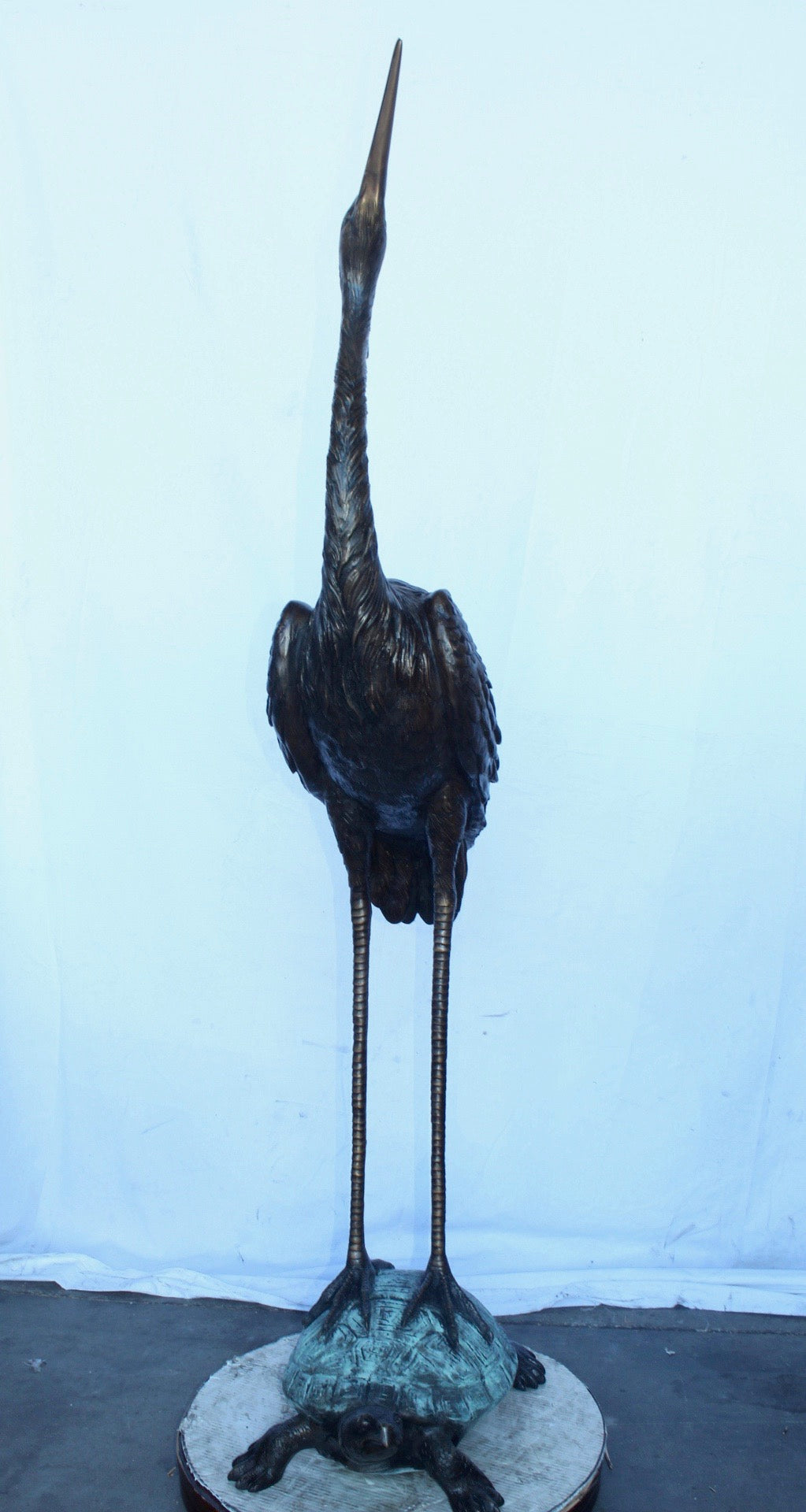 Blue Heron looking up on turtle bronze statue fountain  Size: 21" x 16" x 71"H.