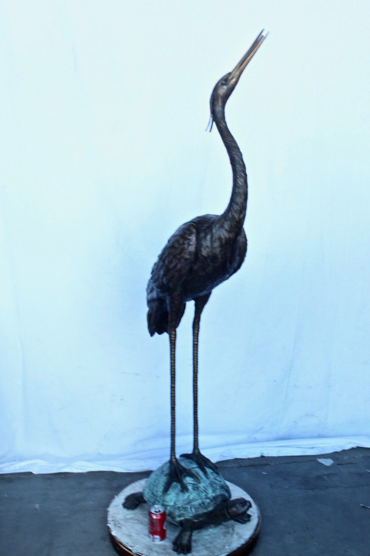 Blue Heron looking up on turtle bronze statue fountain  Size: 21" x 16" x 71"H.