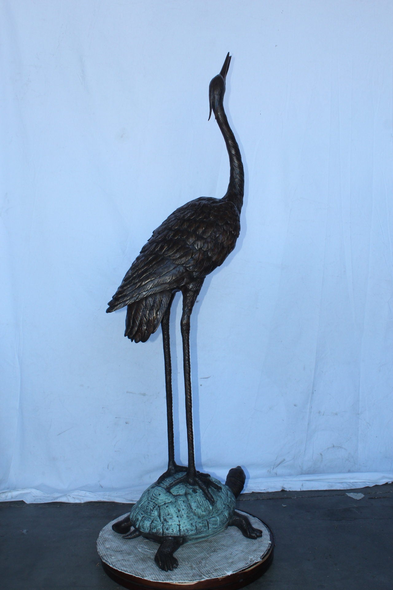 Blue Heron looking up on turtle bronze statue fountain  Size: 21" x 16" x 71"H.