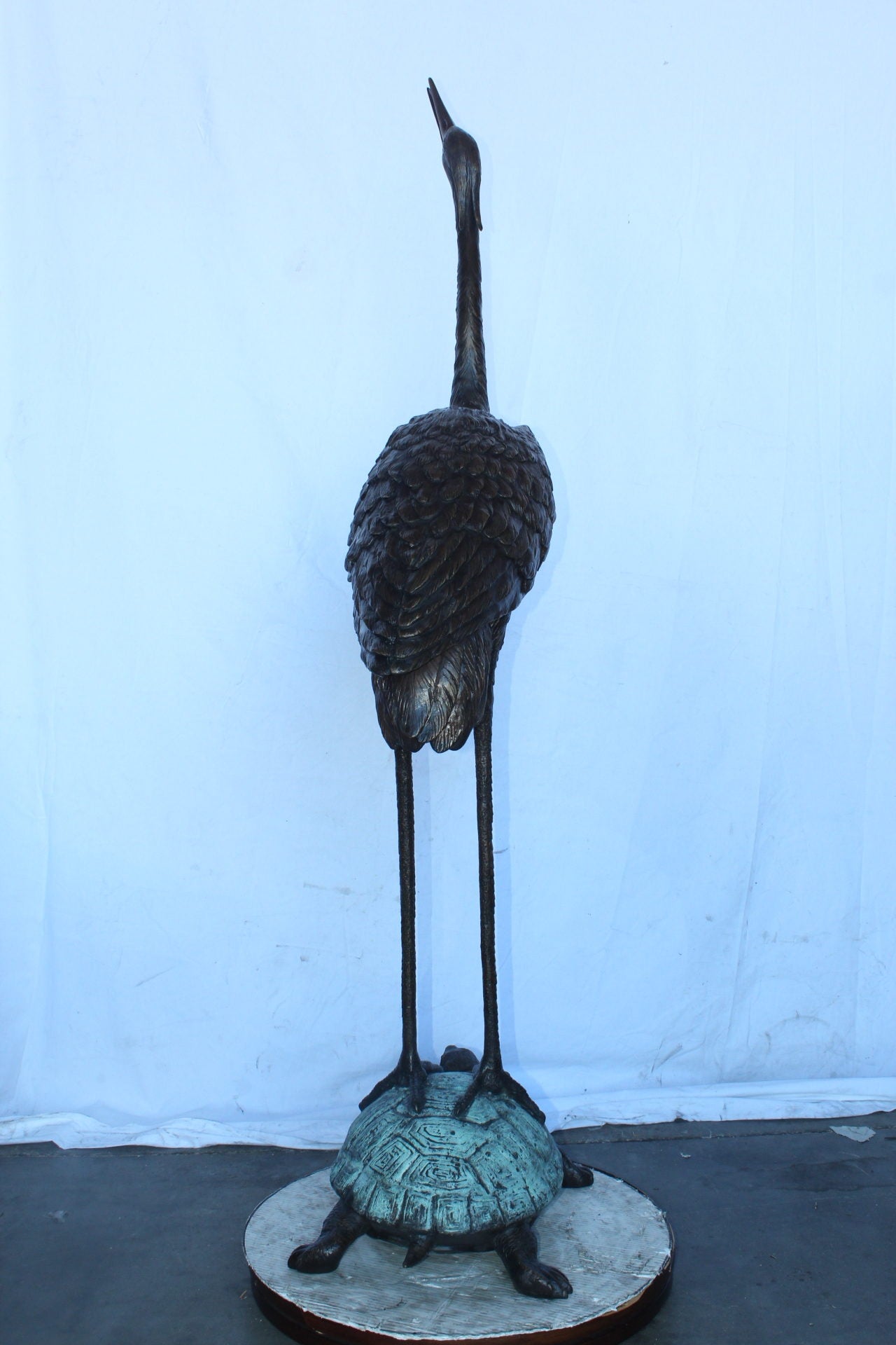 Blue Heron looking up on turtle bronze statue fountain  Size: 21" x 16" x 71"H.