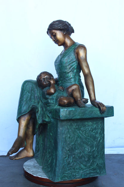 Mother and her sweet sleeping baby bronze statue -  Size: 30"L x 28"W x 49"H.