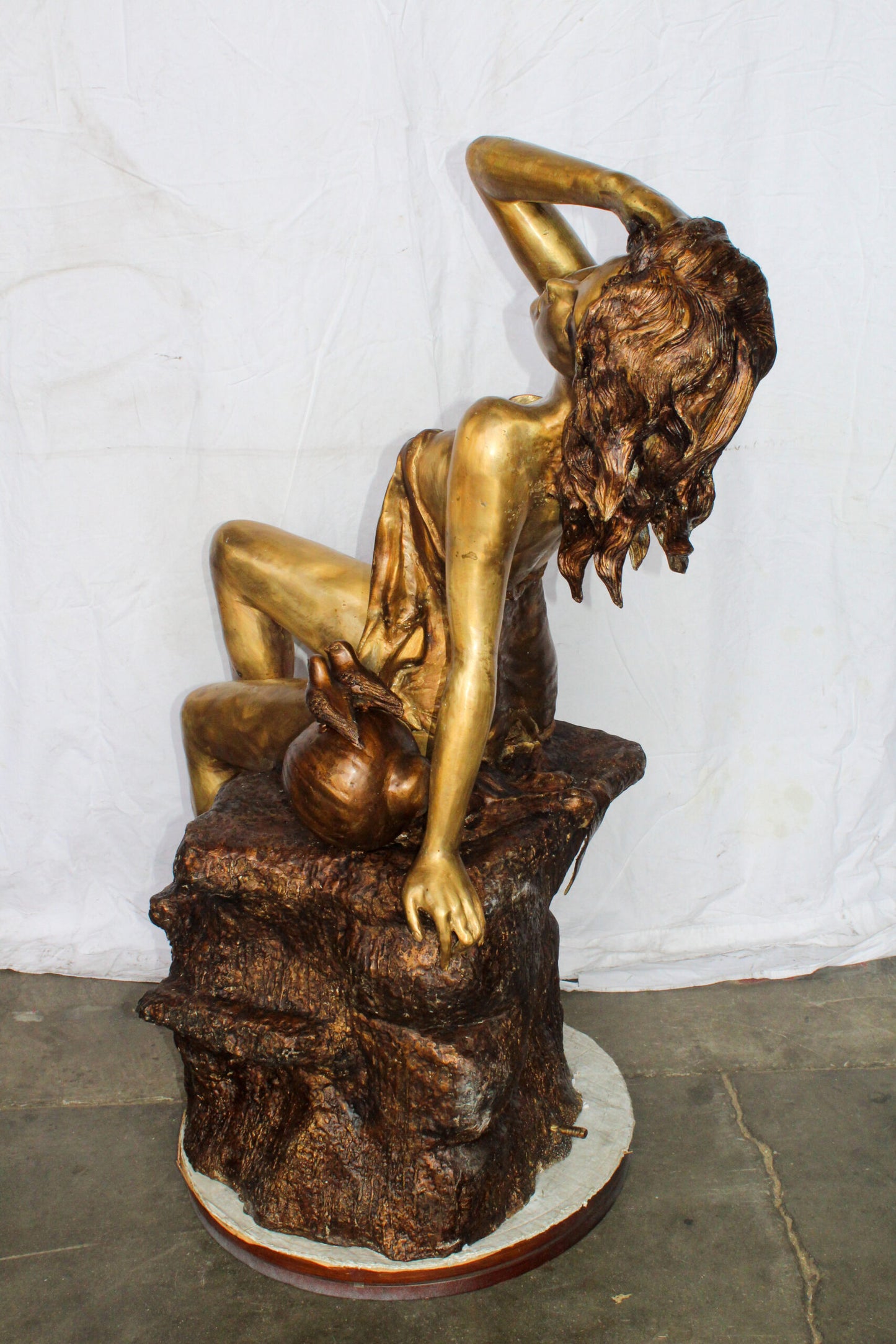Bronze Outdoor Fountain of a Woman Relaxing on Rocks 49" x 39" x 50"H
