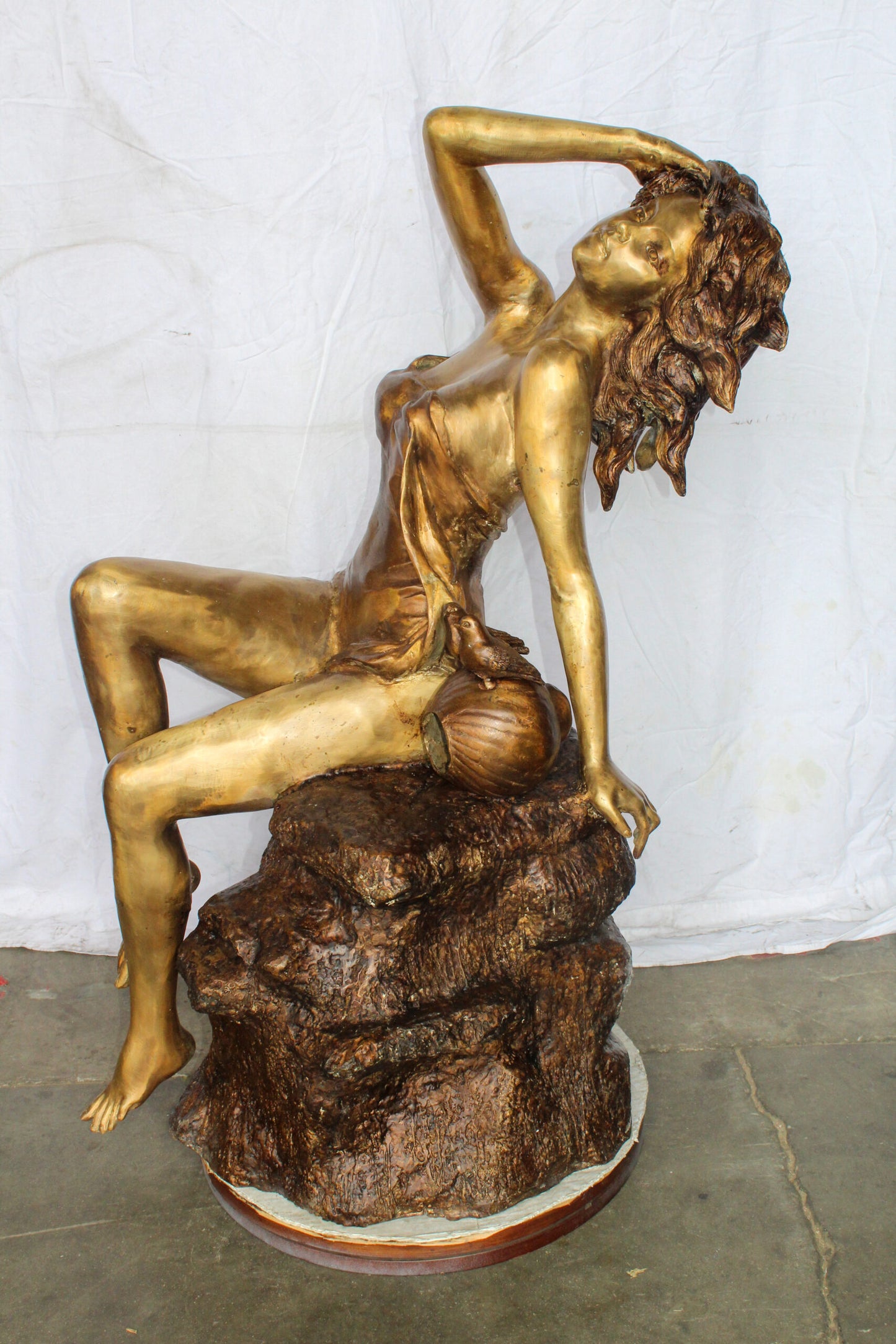 Bronze Outdoor Fountain of a Woman Relaxing on Rocks 49" x 39" x 50"H