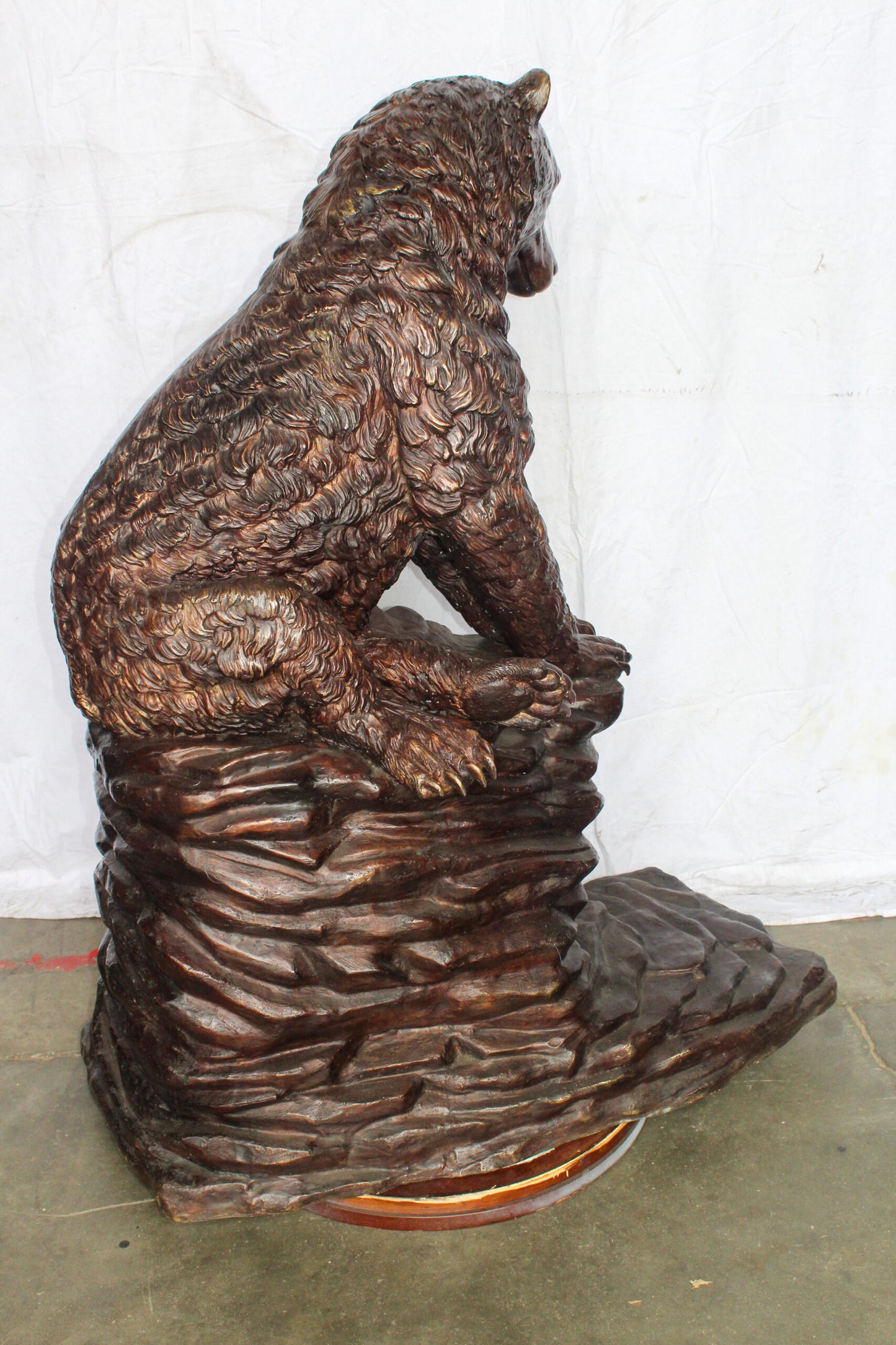 Life Size Bronze Statue of a Bear Sitting on A Rock 43" x 29" x 51"H
