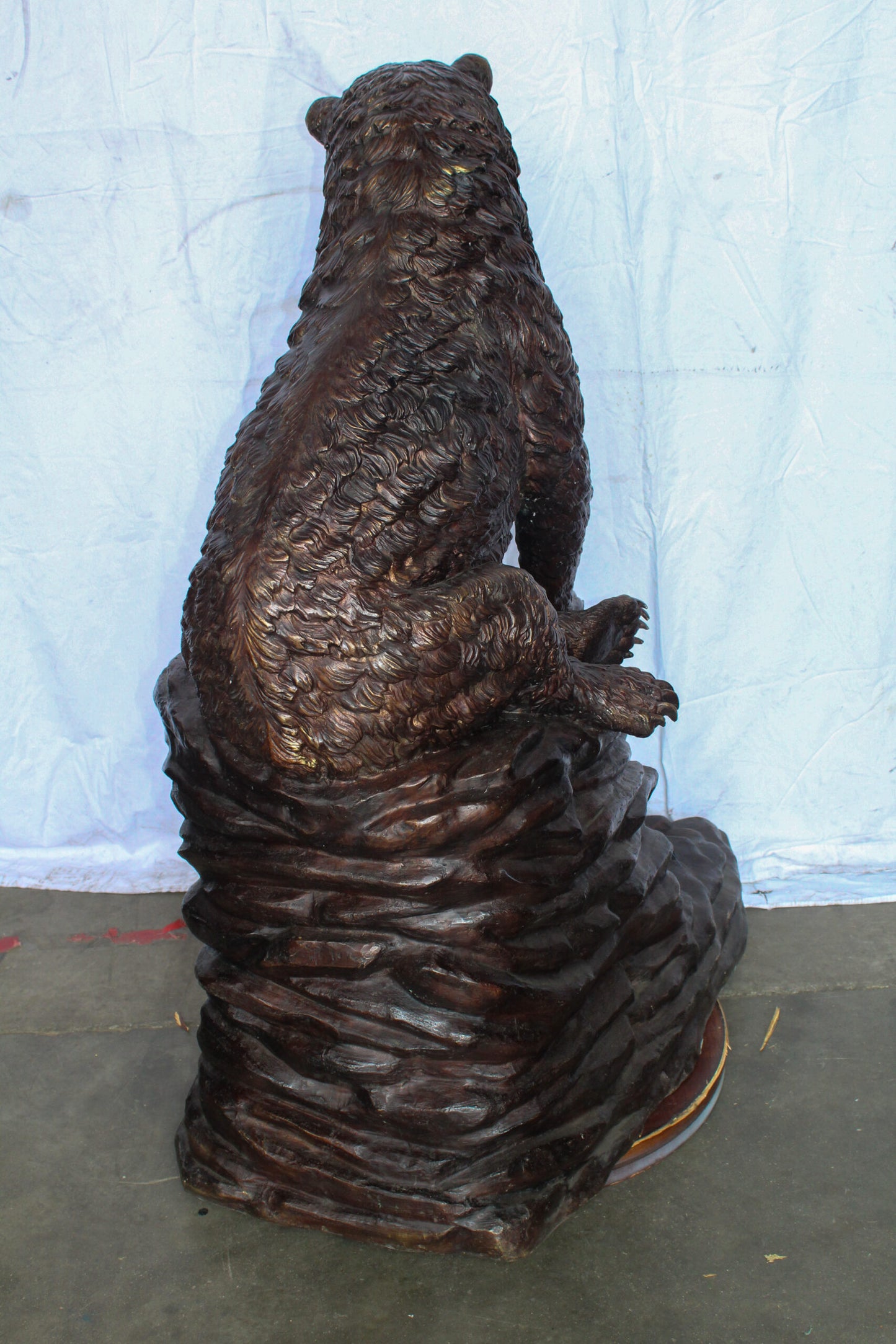 Life Size Bronze Statue of a Bear Sitting on A Rock 43" x 29" x 51"H