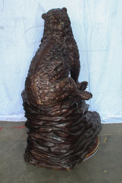 Life Size Bronze Statue of a Bear Sitting on A Rock 43" x 29" x 51"H