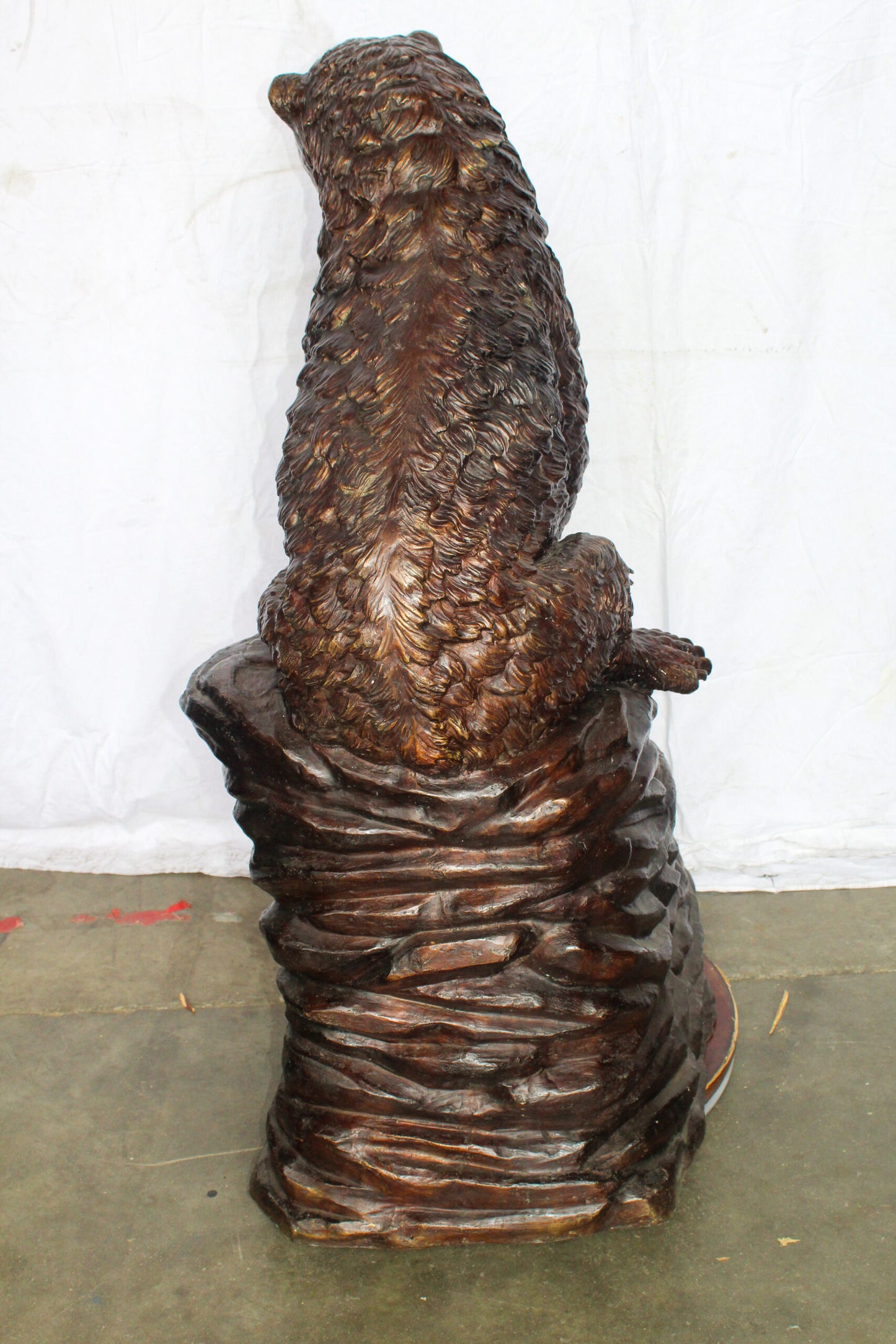 Life Size Bronze Statue of a Bear Sitting on A Rock 43" x 29" x 51"H