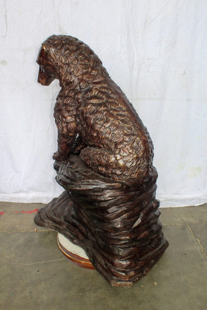 Life Size Bronze Statue of a Bear Sitting on A Rock 43" x 29" x 51"H