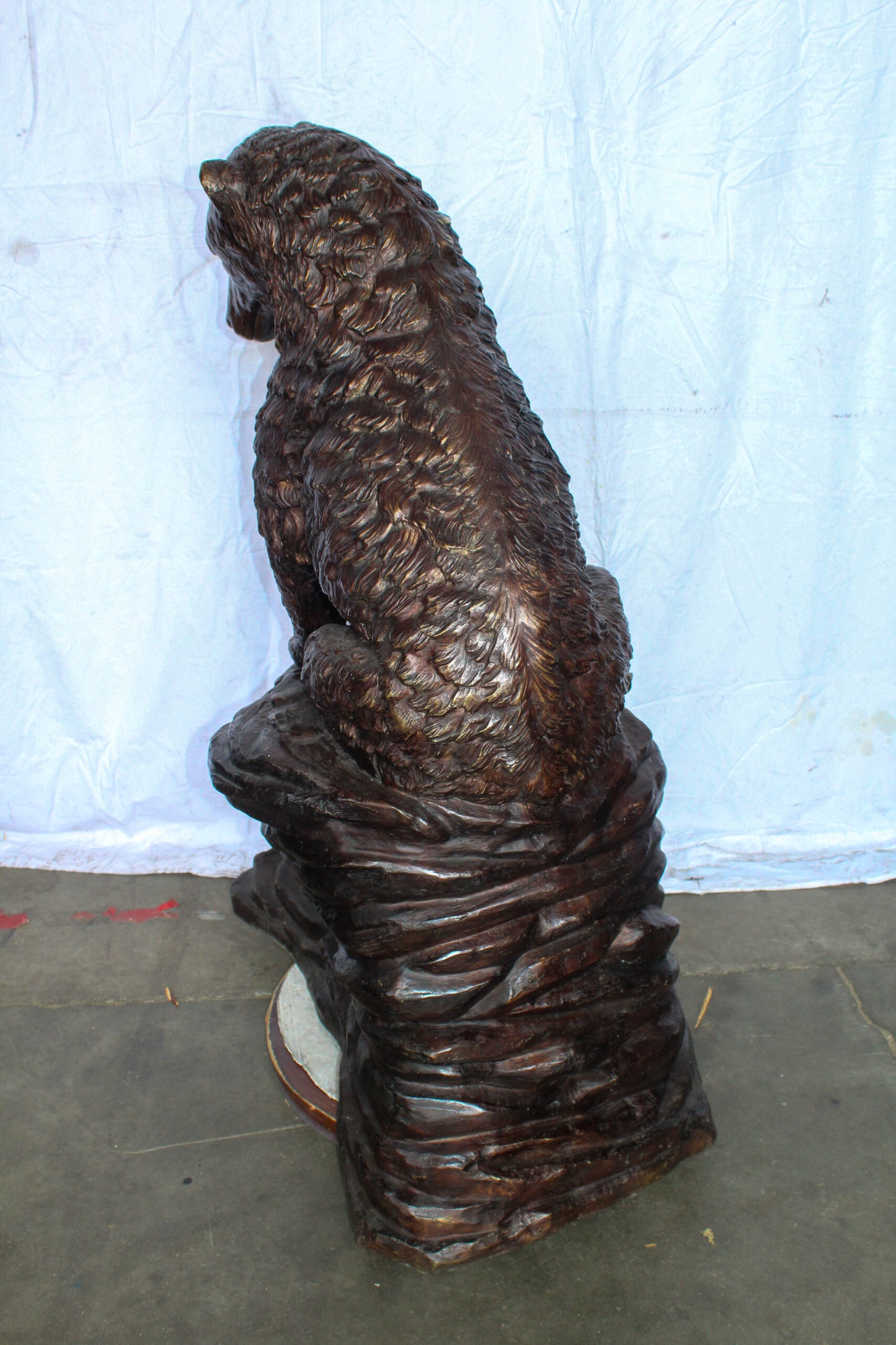 Life Size Bronze Statue of a Bear Sitting on A Rock 43" x 29" x 51"H
