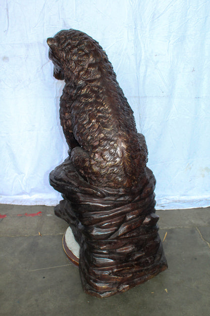 Life Size Bronze Statue of a Bear Sitting on A Rock 43" x 29" x 51"H