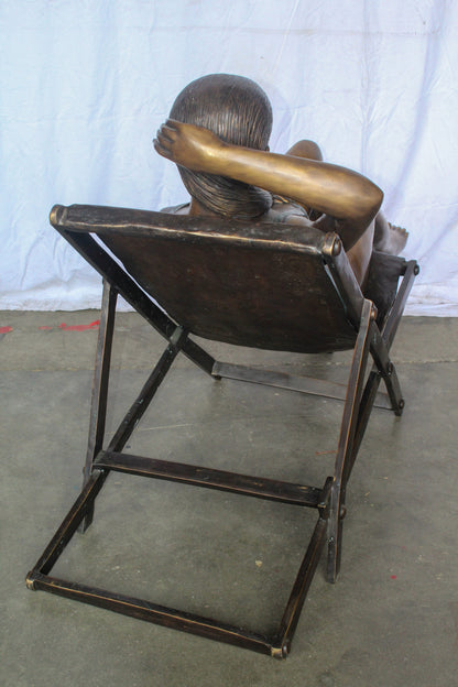 Life Size Bronze Statue of a Lady Sitting on a Beach Chair 64" x 25" x 38"H