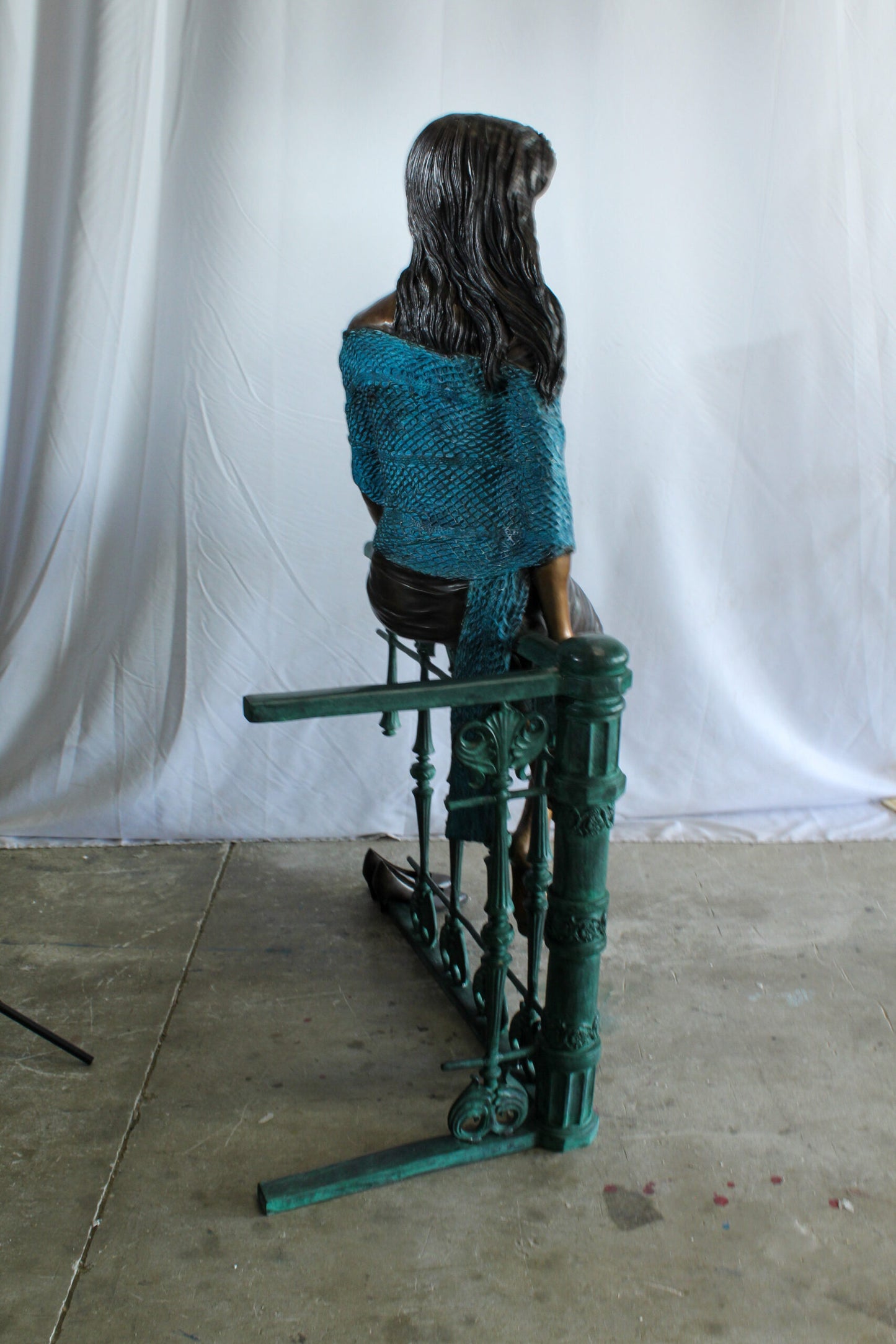 Bronze Statue of a Woman Sitting on Railing Holding a Rose 35" x 55" x 67"H