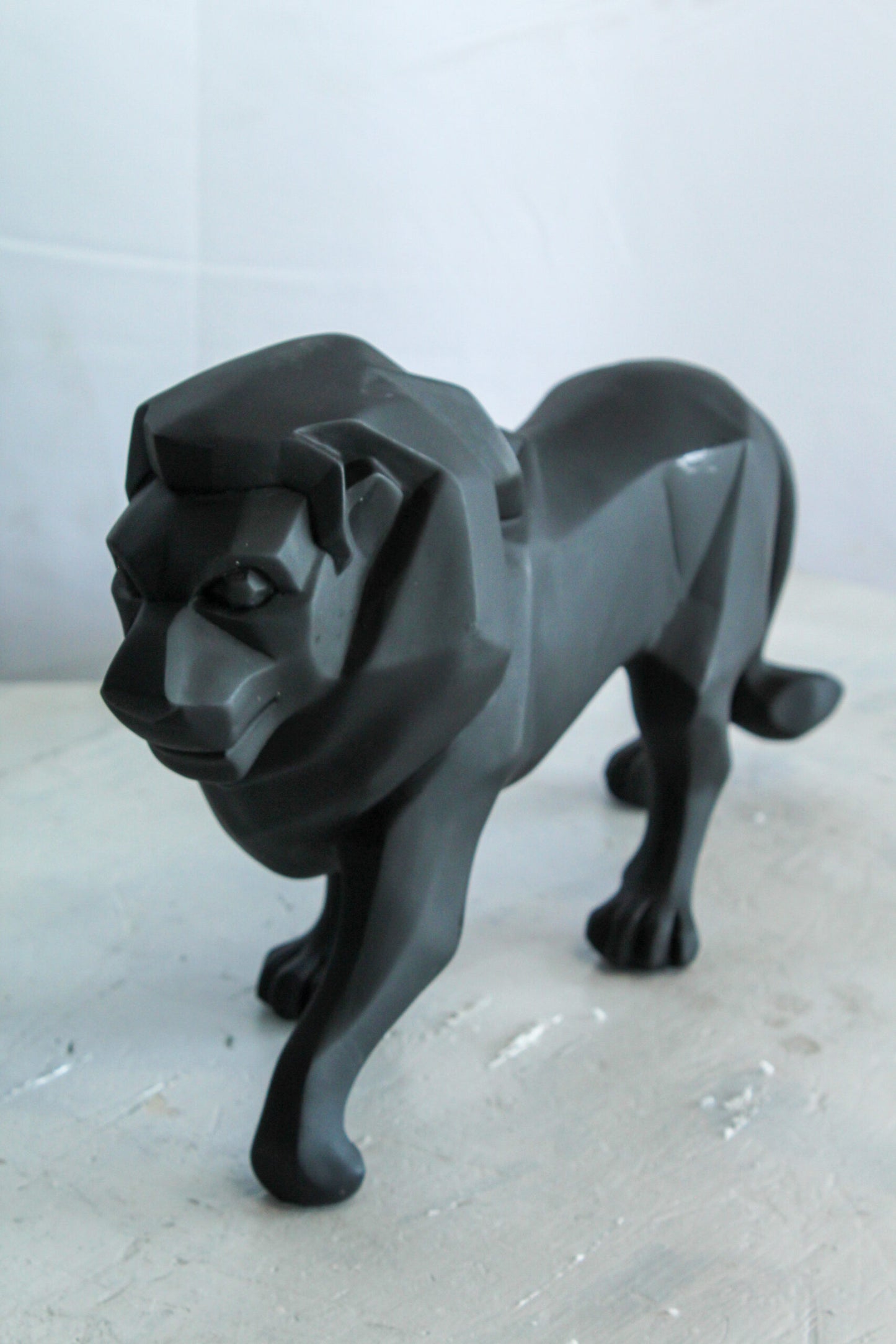 Black Resin Geometric Lion Sculpture in Modern Walking Pose   17" x 5" x 9"H