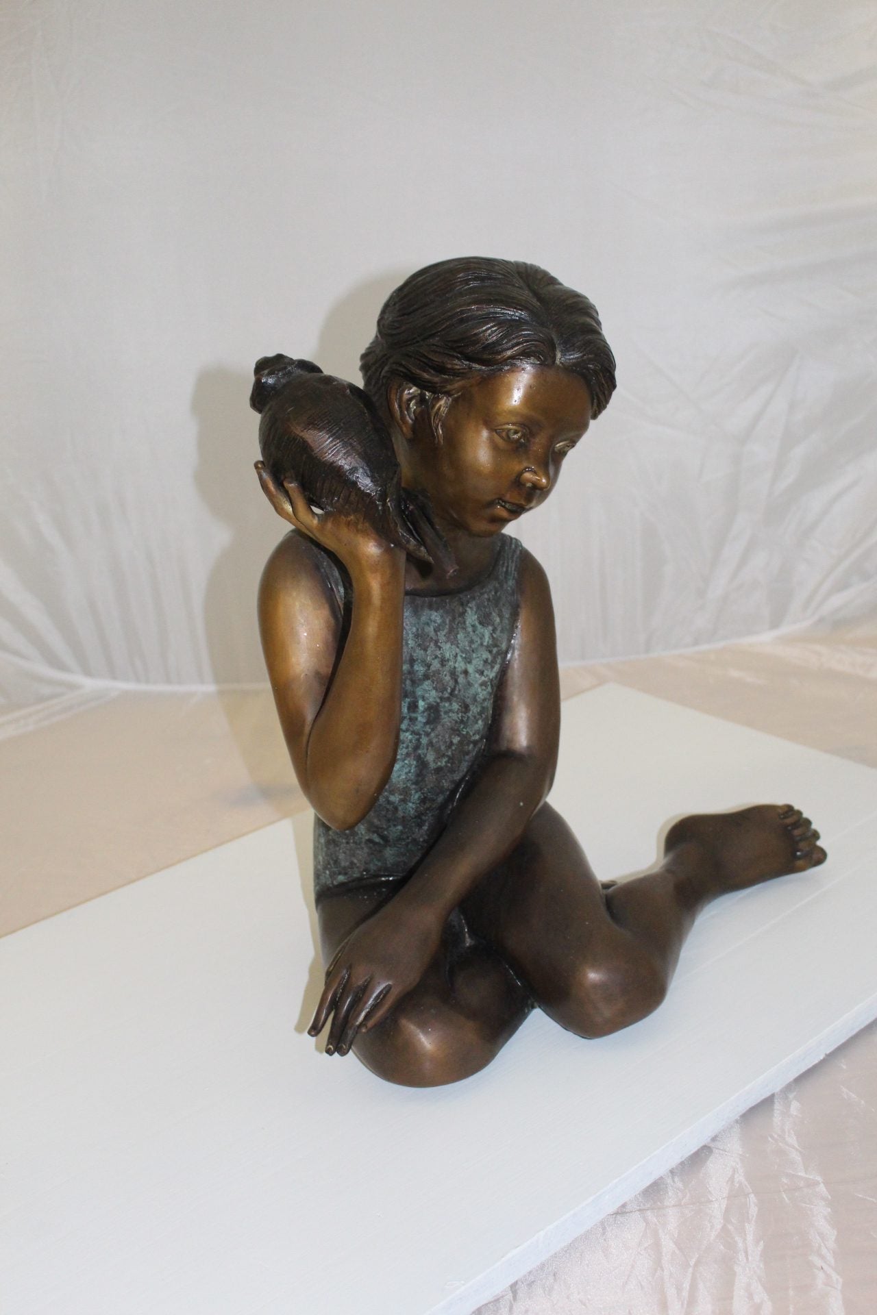 Girl listening to a Shell fountain-Bronze Statue -  Size: 17"L x 10"W x 20"H. 