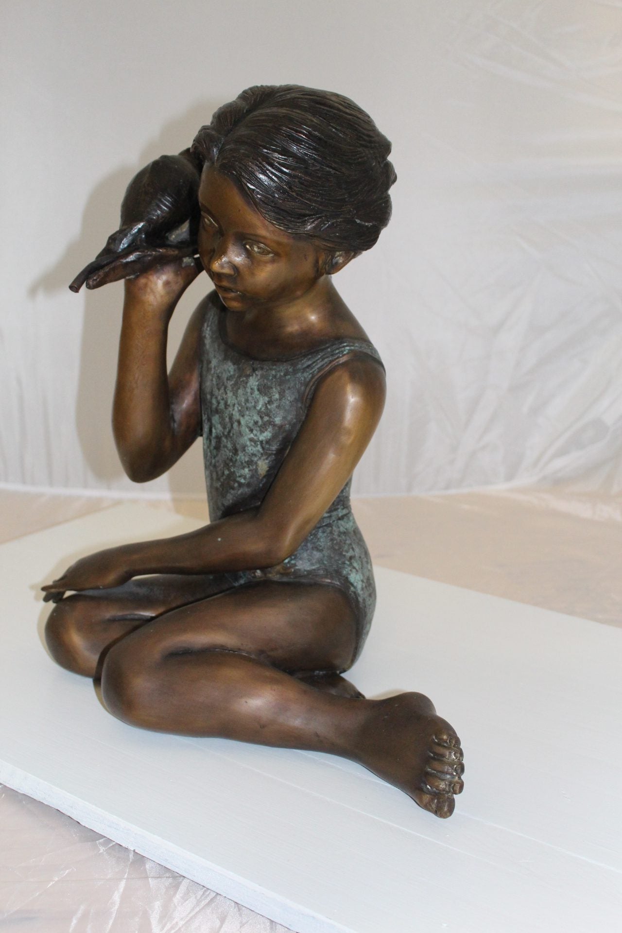 Girl listening to a Shell fountain-Bronze Statue -  Size: 17"L x 10"W x 20"H. 