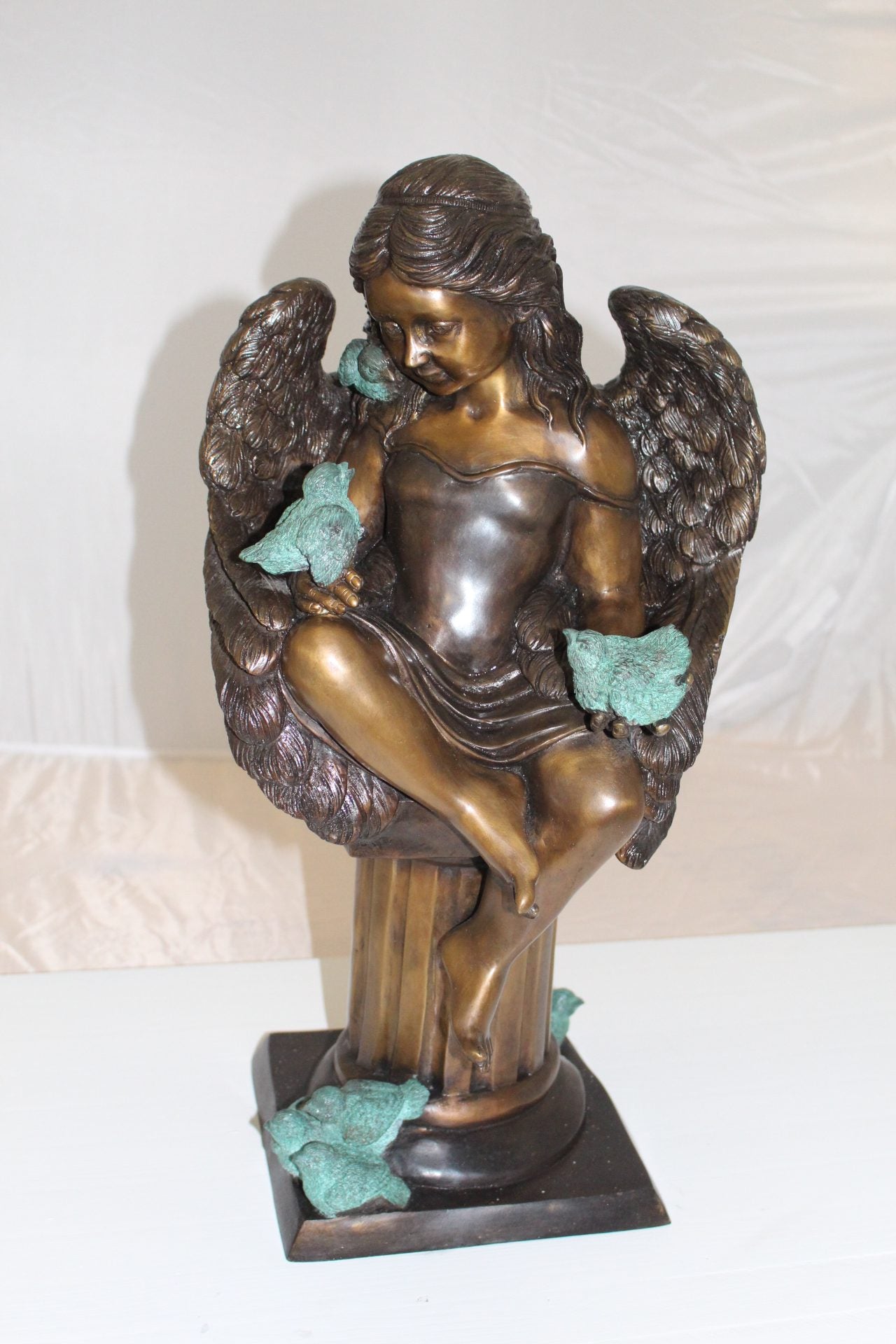 Angel sitting on Column Bronze Statue -  Size: 10"L x 9"W x 22"H. 