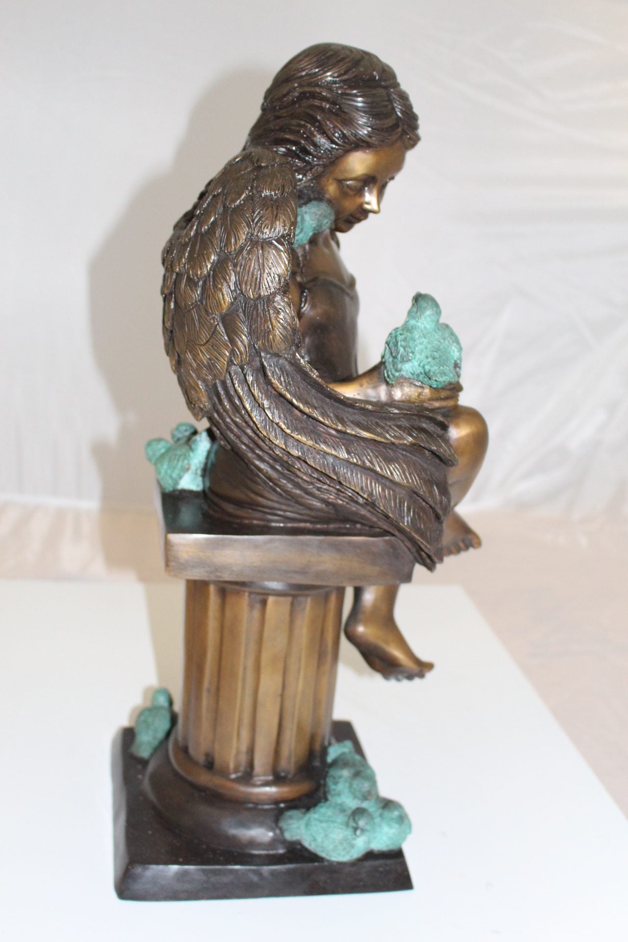 Angel sitting on Column Bronze Statue -  Size: 10"L x 9"W x 22"H. 
