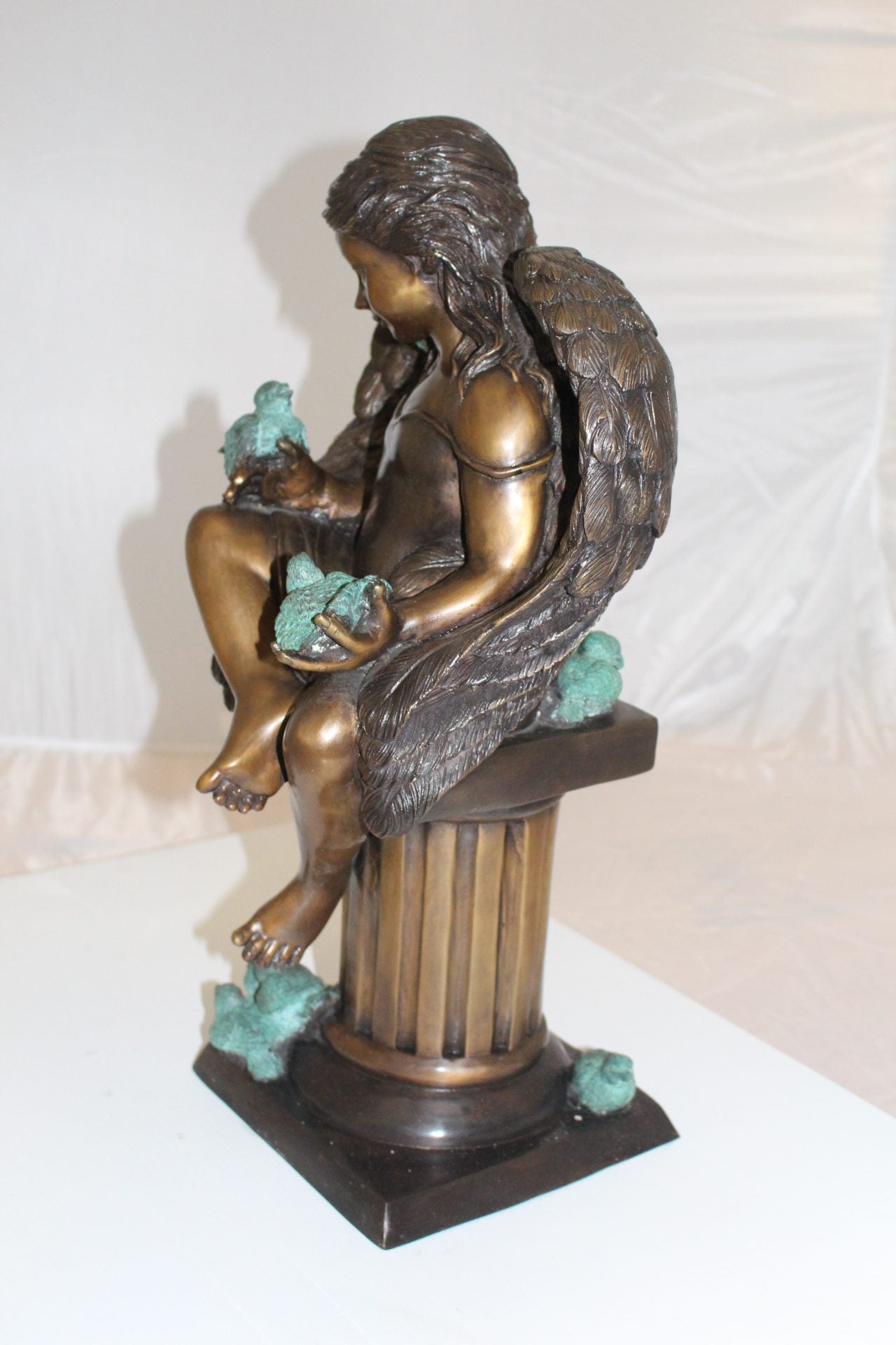 Angel sitting on Column Bronze Statue -  Size: 10"L x 9"W x 22"H. 