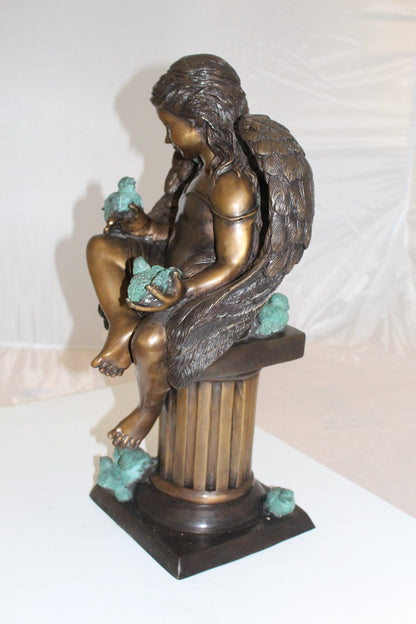 Angel sitting on Column Bronze Statue -  Size: 10"L x 9"W x 22"H. 