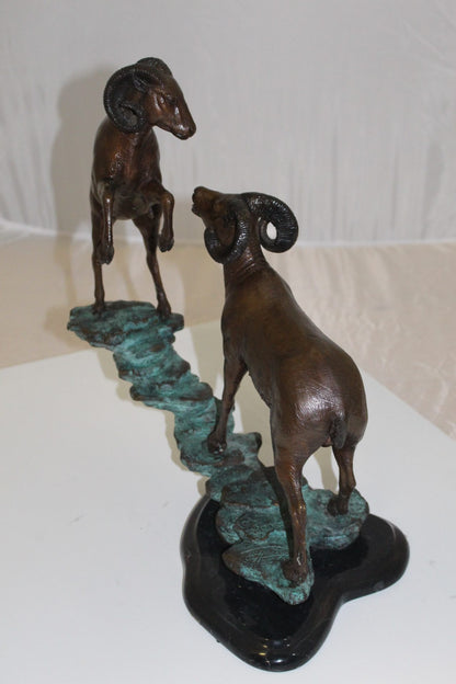 Two Rams on a rock Bronze Statue -  Size: 15"L x 8"W x 16"H. 