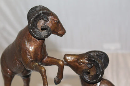 Two Rams on a rock Bronze Statue -  Size: 15"L x 8"W x 16"H. 