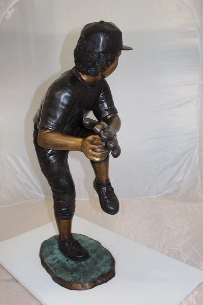 Boy plays baseball Bronze Statue -  Size: 22"L x 12"W x 36"H. 