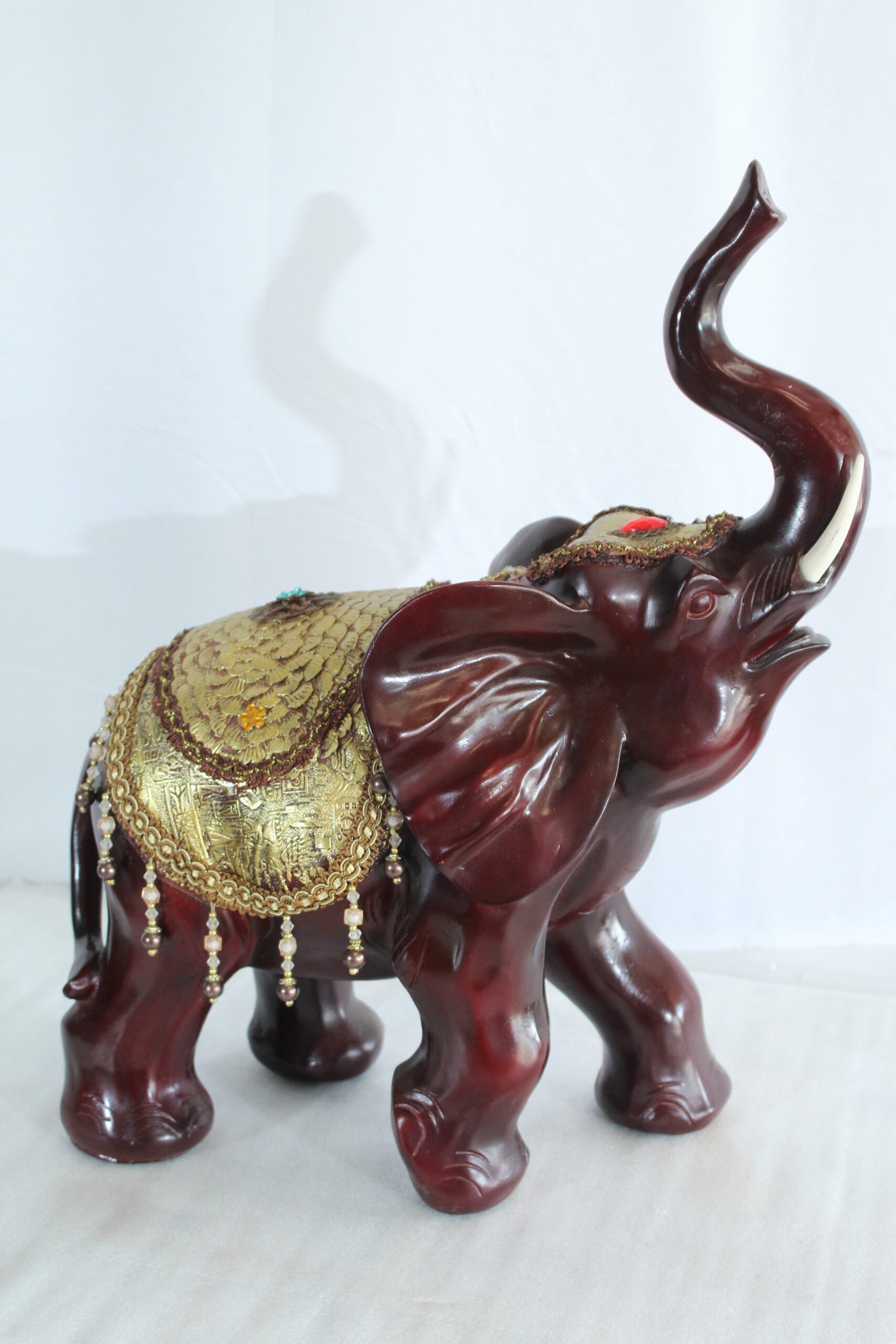 Resin Elephant Statue with Gold Saddle and Raised Trunk 19" x 10" x 22"H