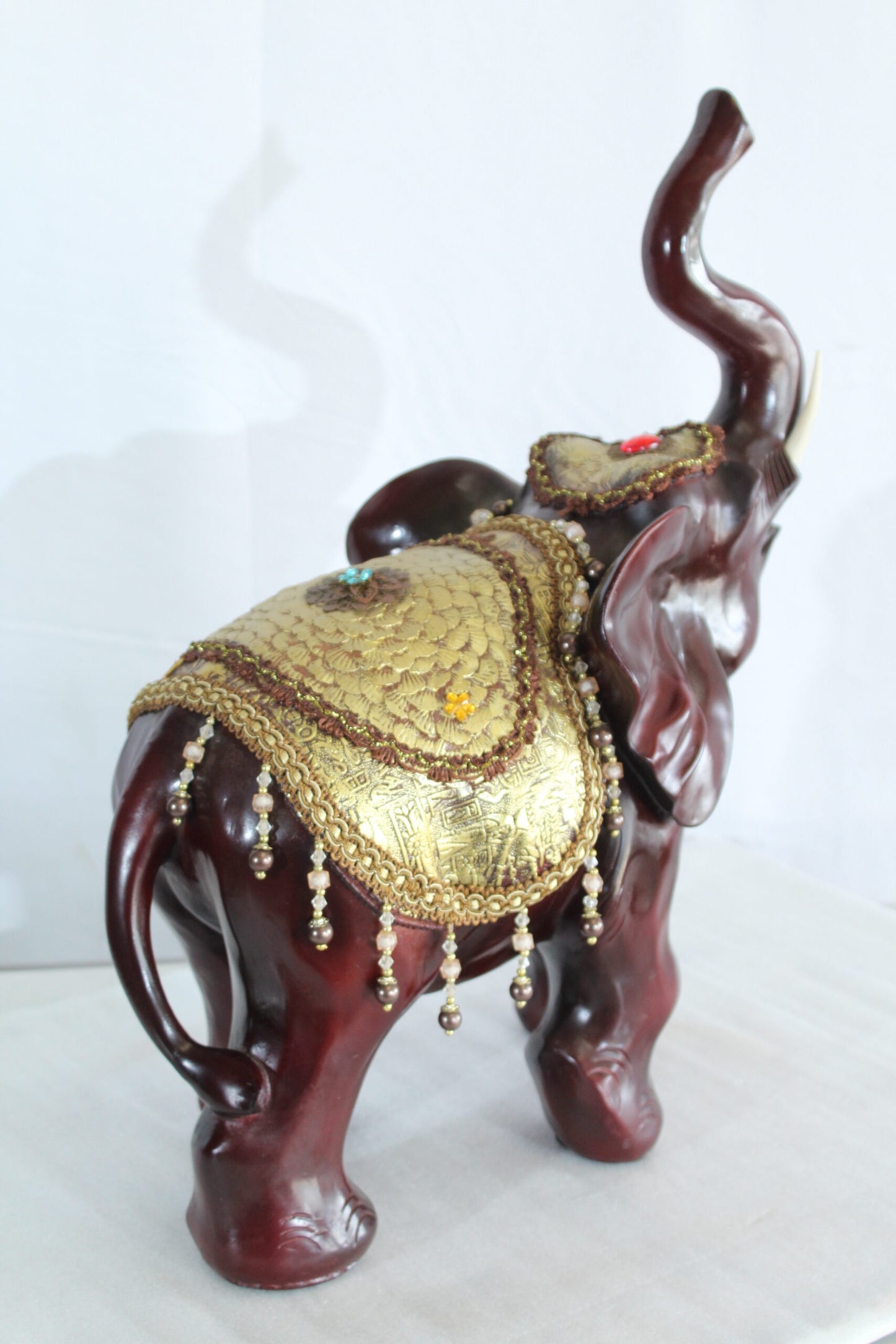Resin Elephant Statue with Gold Saddle and Raised Trunk 19" x 10" x 22"H
