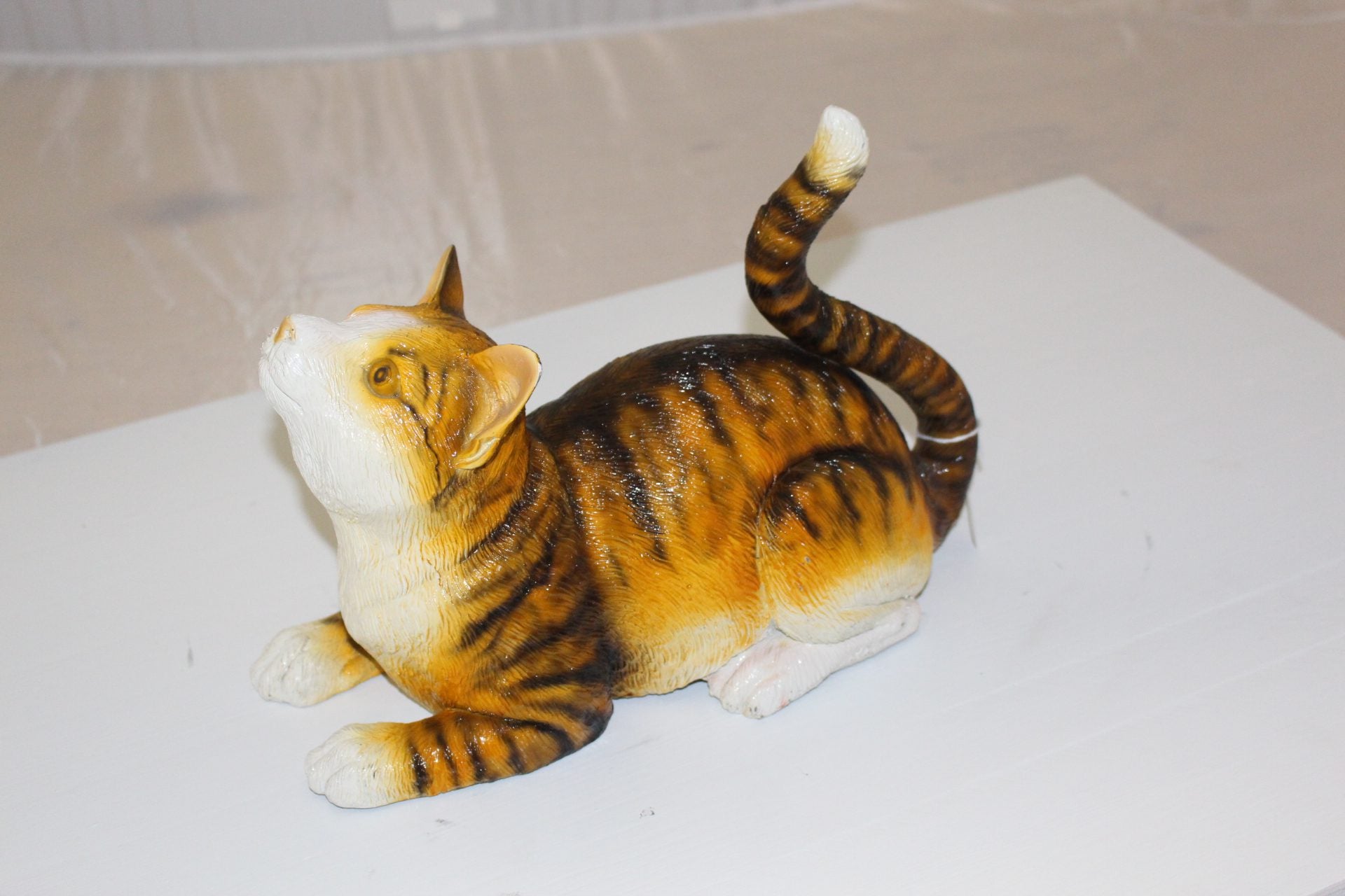 Squat cat Bronze Statue -  Size: 12"L x 6"W x 9"H. 