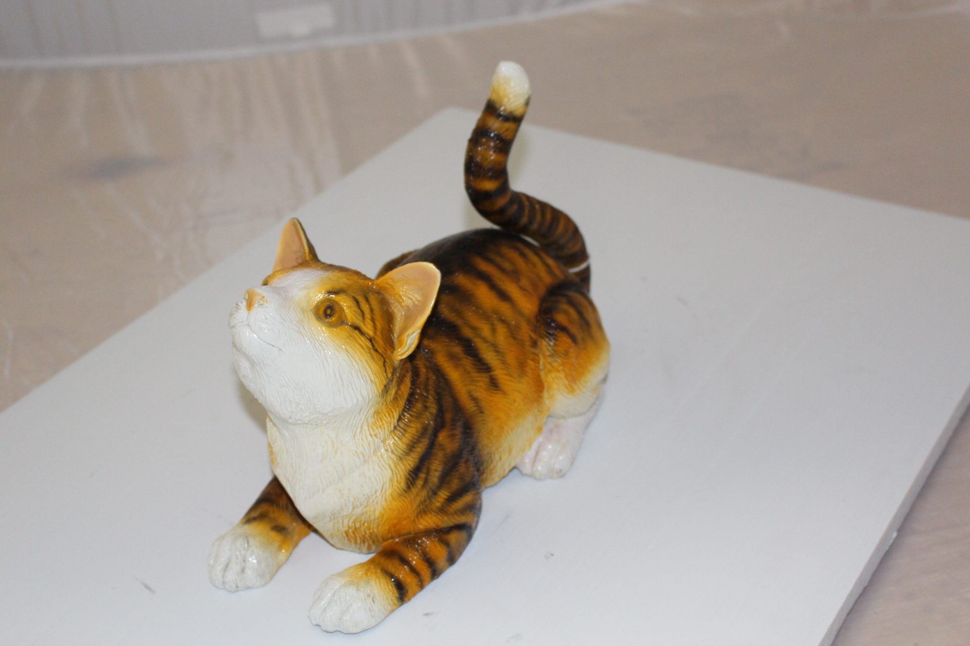 Squat cat Bronze Statue -  Size: 12"L x 6"W x 9"H. 