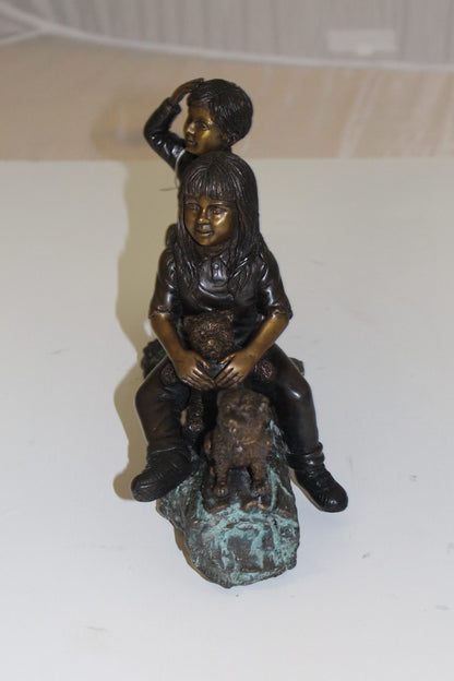 Two kids with dog on log Bronze Statue -  Size: 12"L x 5"W x 8.5"H. 