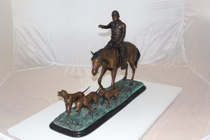 Hunter with 3 dogs Bronze Statue -  Size: 26"L x 8"W x 19"H. 