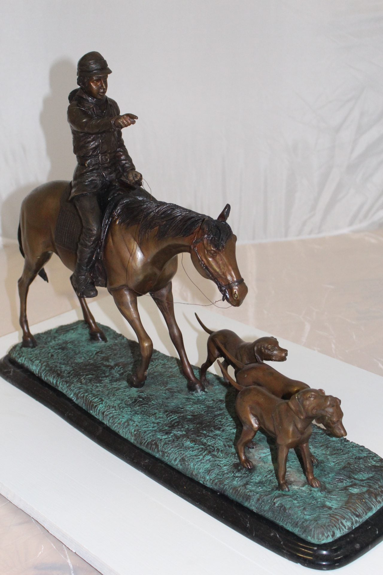 Hunter with 3 dogs Bronze Statue -  Size: 26"L x 8"W x 19"H. 