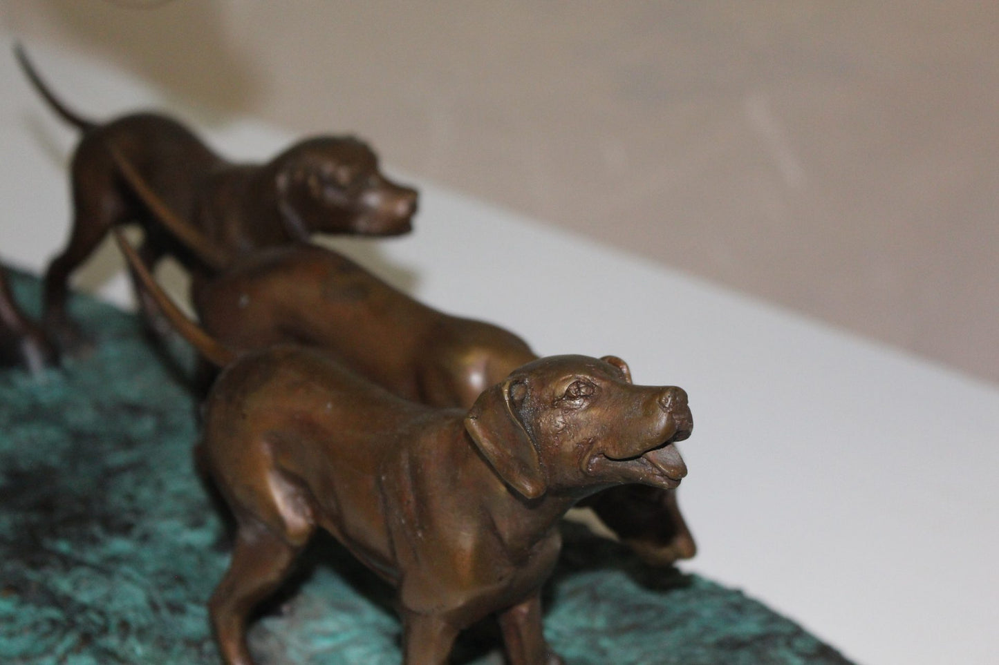 Hunter with 3 dogs Bronze Statue -  Size: 26"L x 8"W x 19"H. 