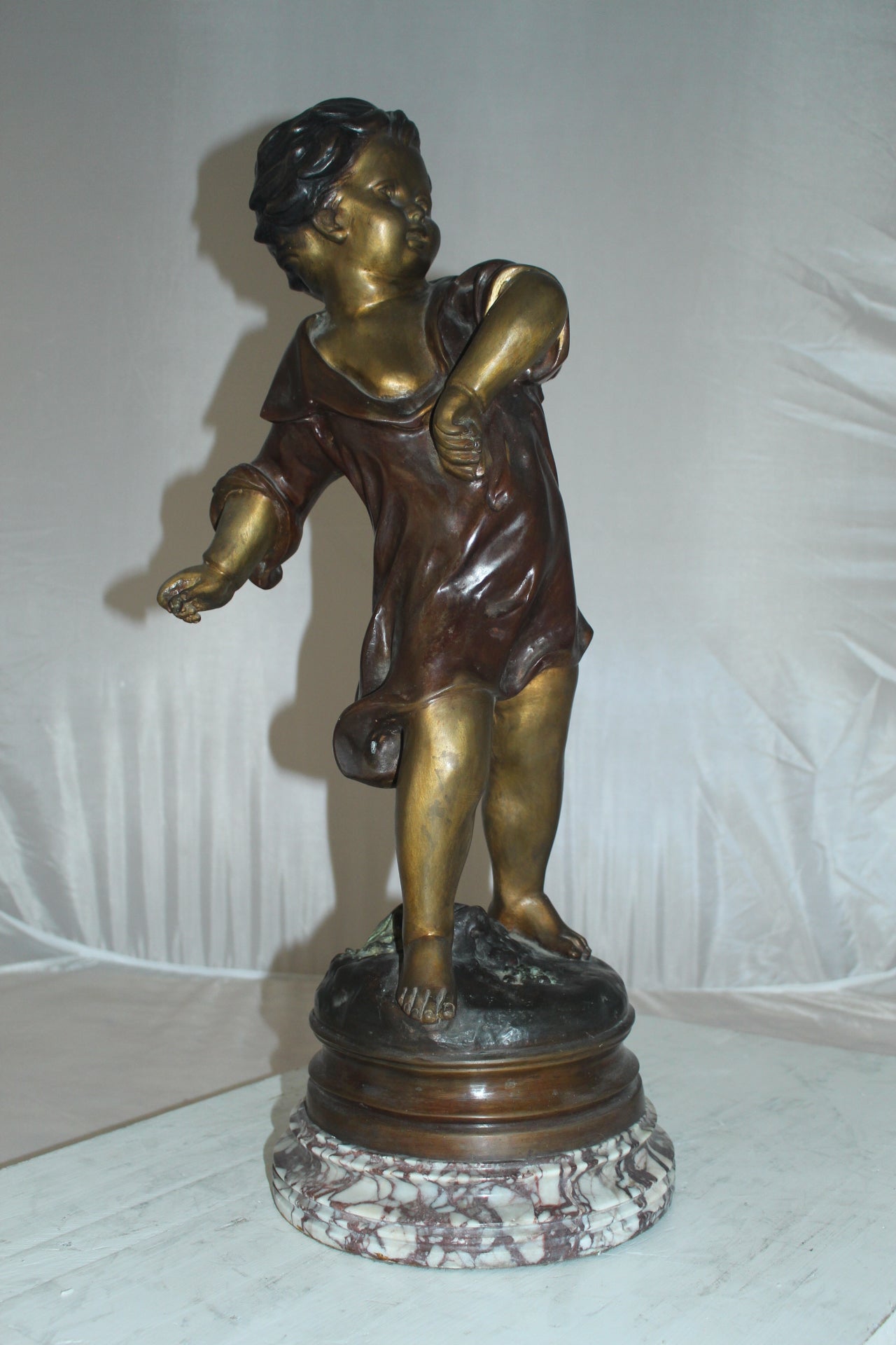 Boy standing Bronze Statue on Marble base -  Size: 10"L x 12"W x 26"H. 