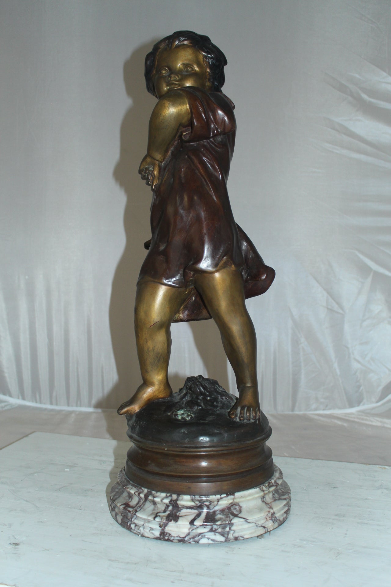 Boy standing Bronze Statue on Marble base -  Size: 10"L x 12"W x 26"H. 