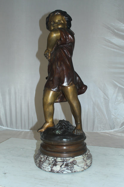 Boy standing Bronze Statue on Marble base -  Size: 10"L x 12"W x 26"H. 