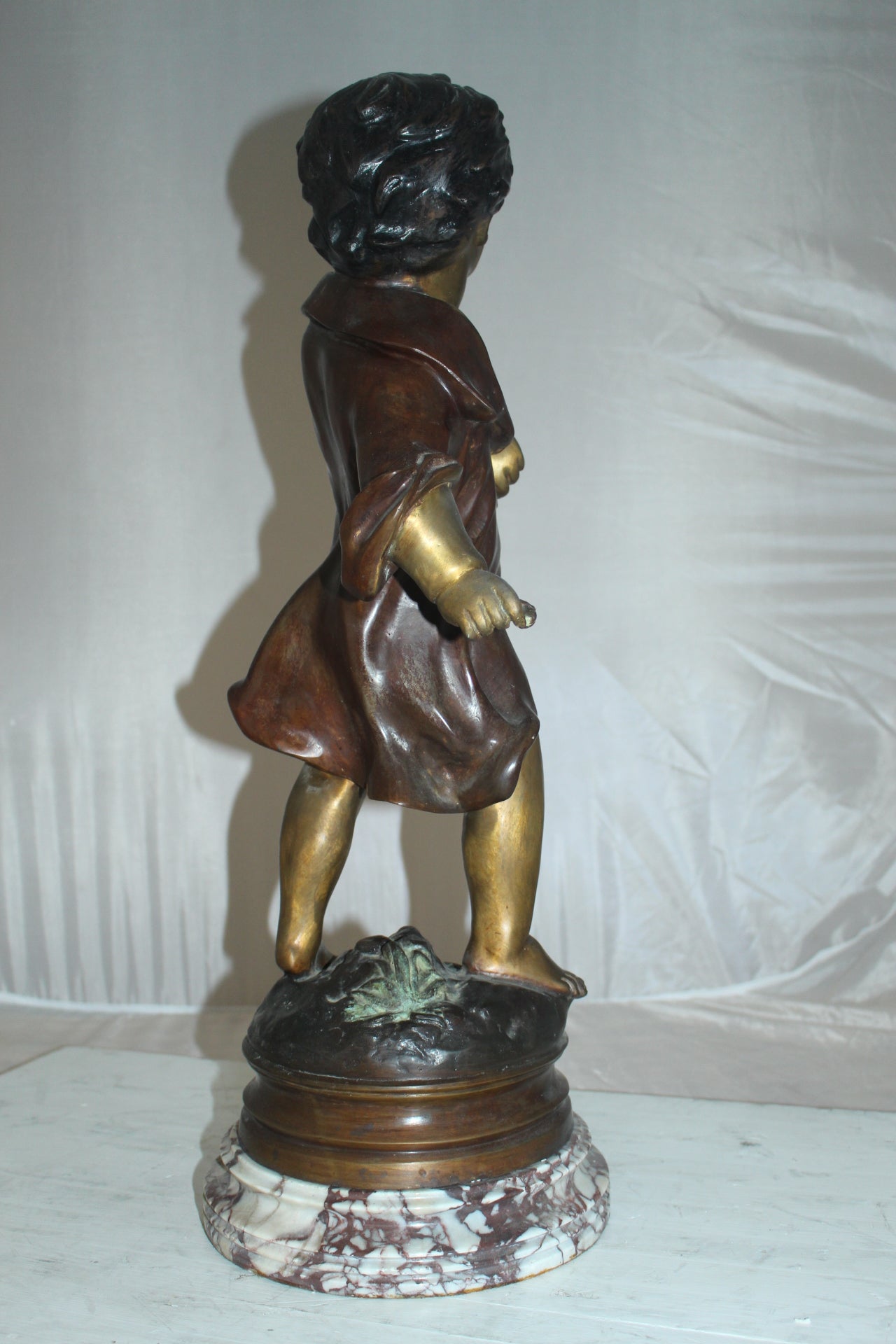 Boy standing Bronze Statue on Marble base -  Size: 10"L x 12"W x 26"H. 