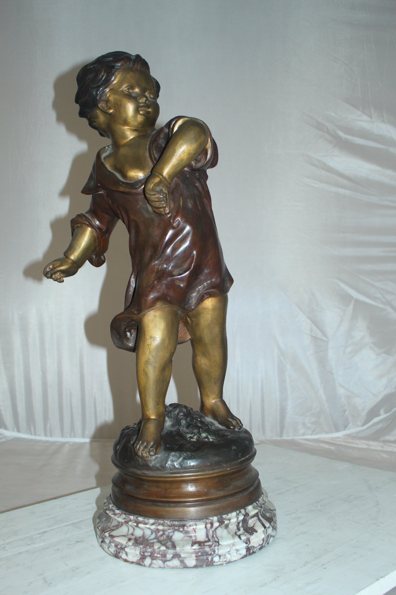 Boy standing Bronze Statue on Marble base -  Size: 10"L x 12"W x 26"H. 