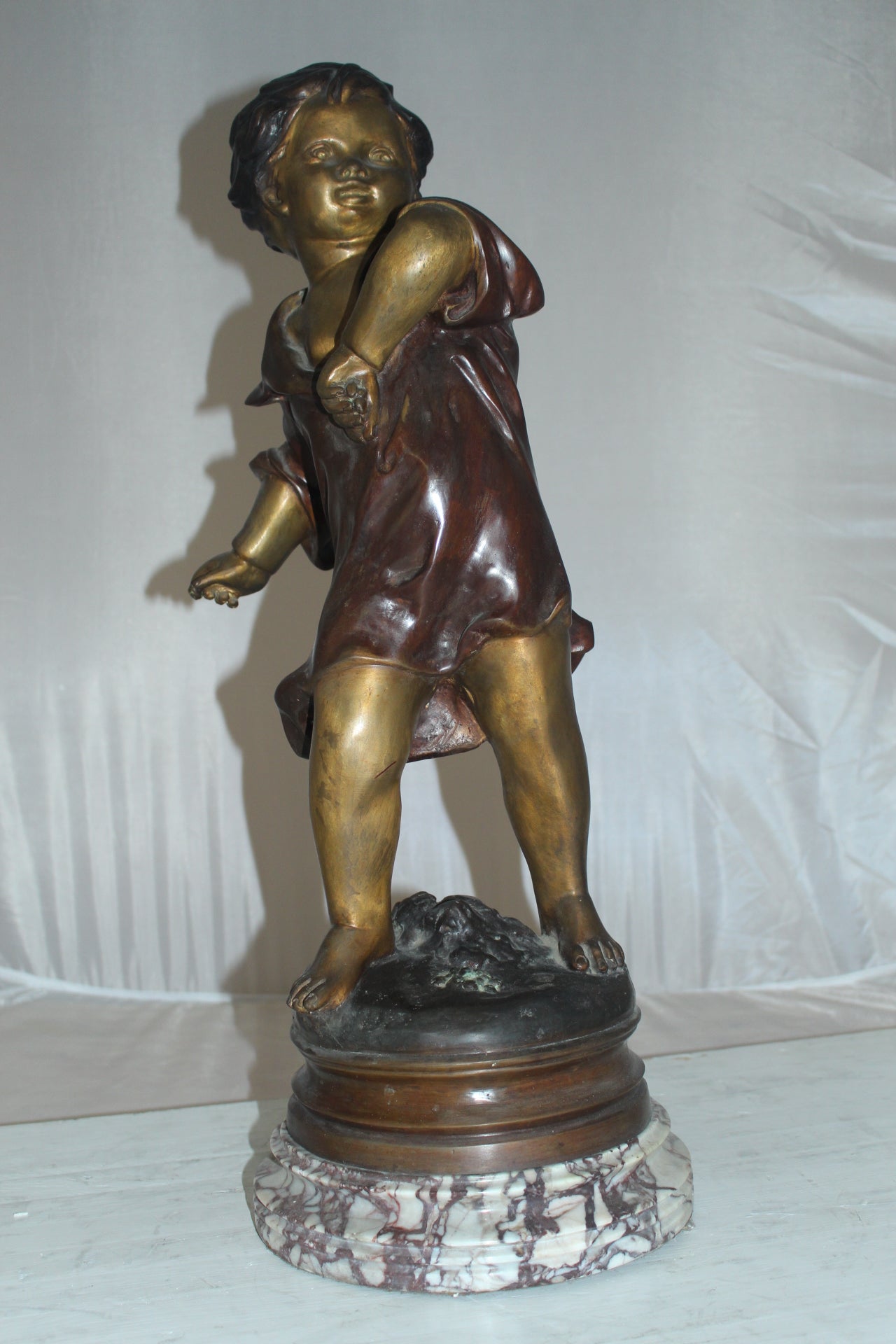 Boy standing Bronze Statue on Marble base -  Size: 10"L x 12"W x 26"H. 