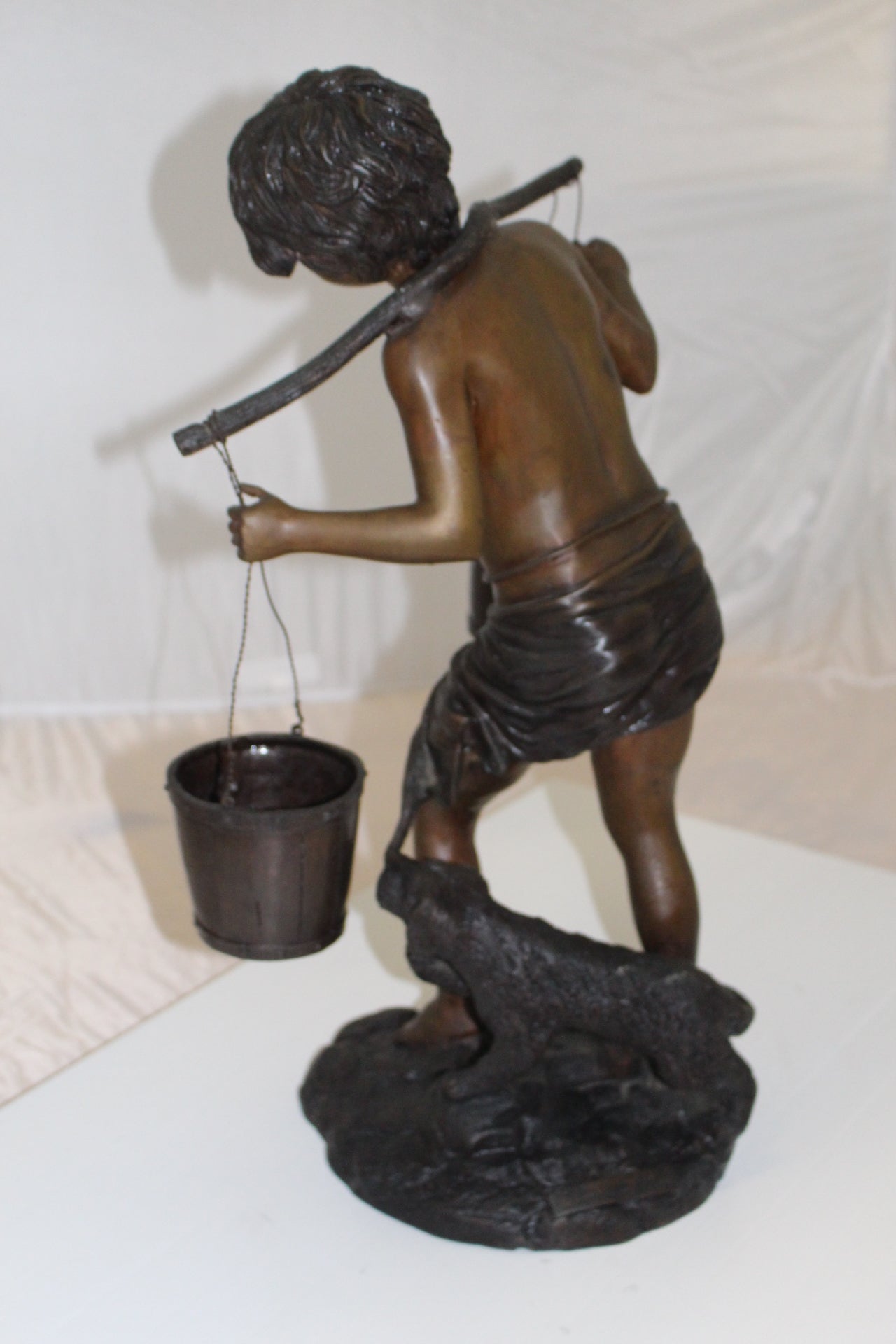 Boy with two buckets Bronze Statue -  Size: 14.5"L x 10"W x 23"H. 