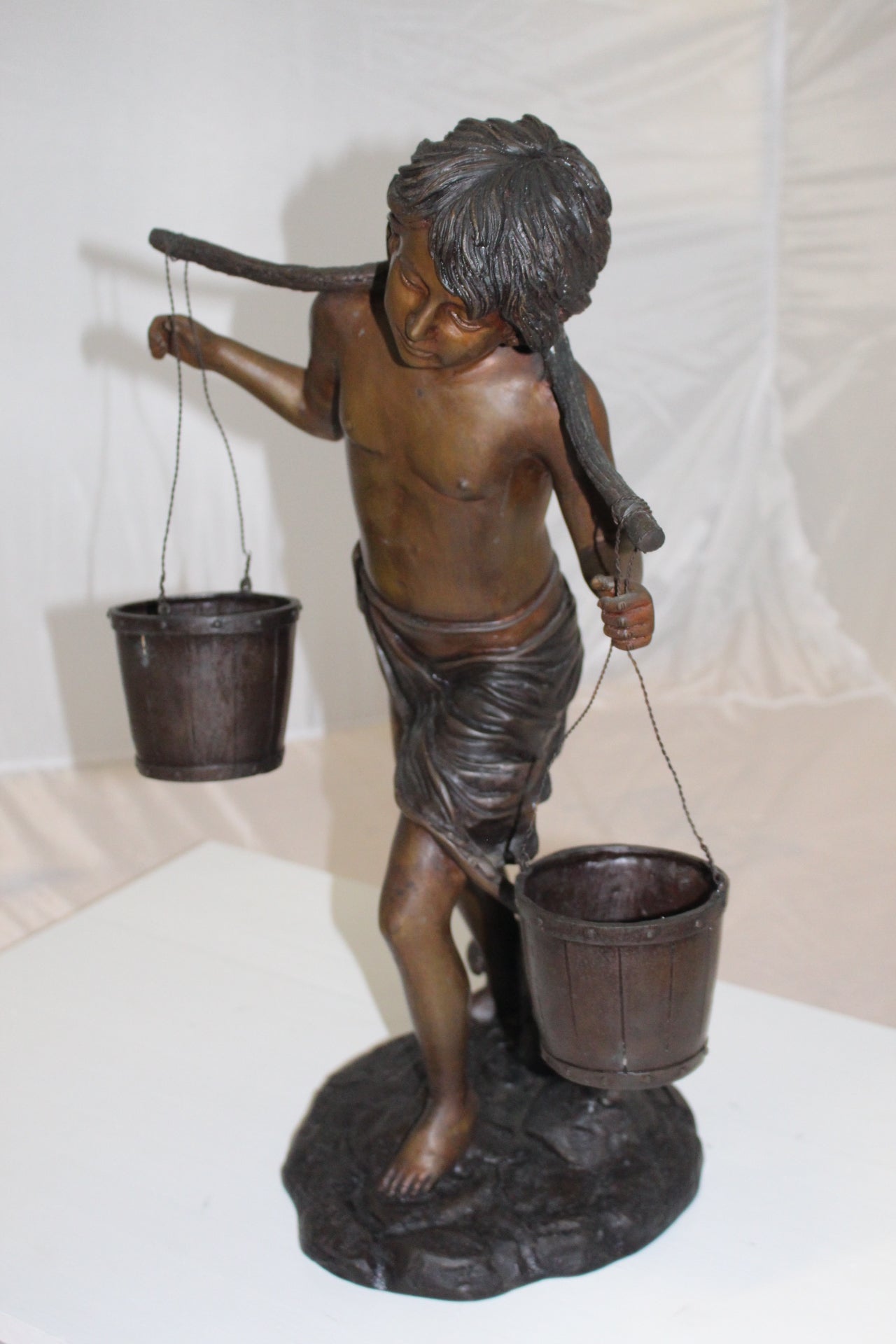 Boy with two buckets Bronze Statue -  Size: 14.5"L x 10"W x 23"H. 