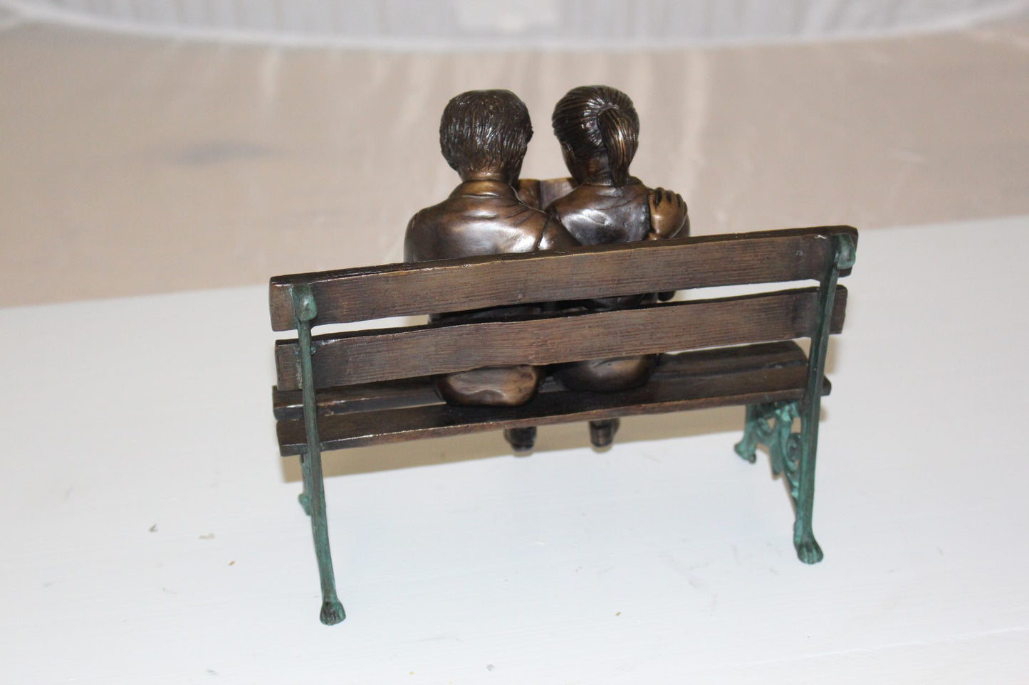 Two kids on bench reading a book - Bronze Statue -  Size: 9"L x 6"W x 8"H. 