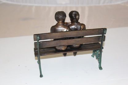 Two kids on bench reading a book - Bronze Statue -  Size: 9"L x 6"W x 8"H. 